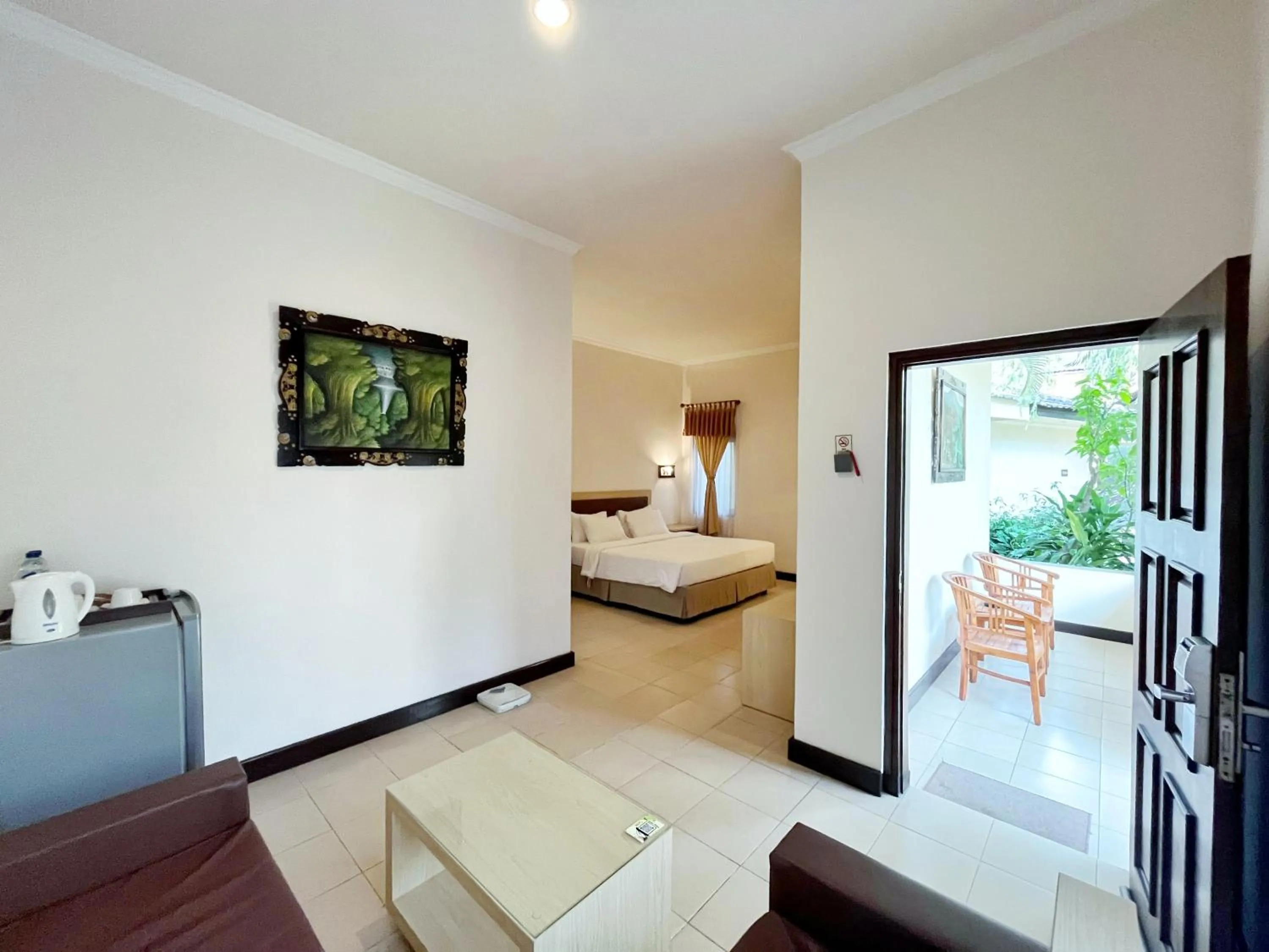 Living room, Bed in Lombok Garden Hotel