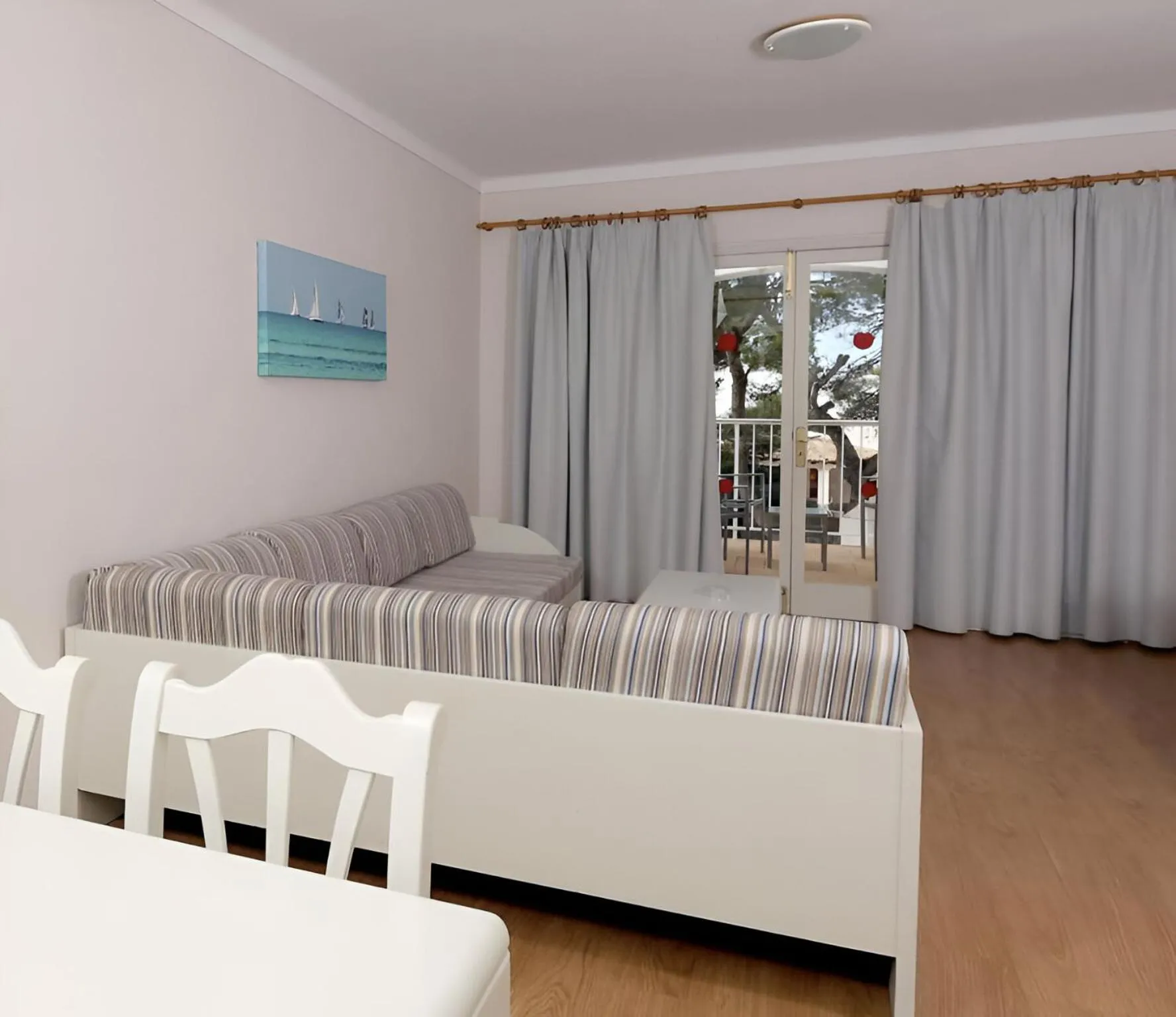 Living room, Bed in Hotel Club Es Talaial