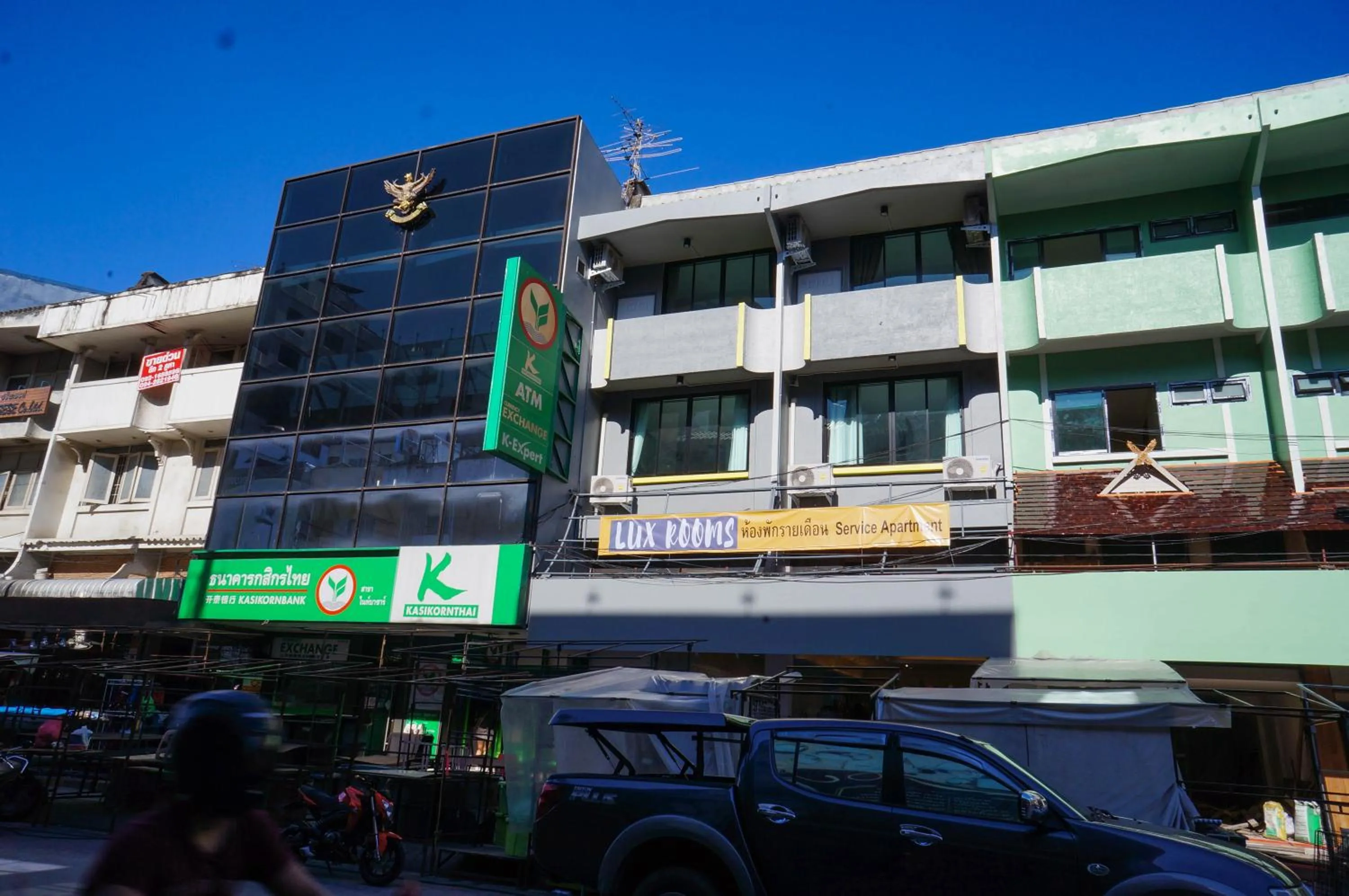 Property building in Lux Rooms Night Bazaar