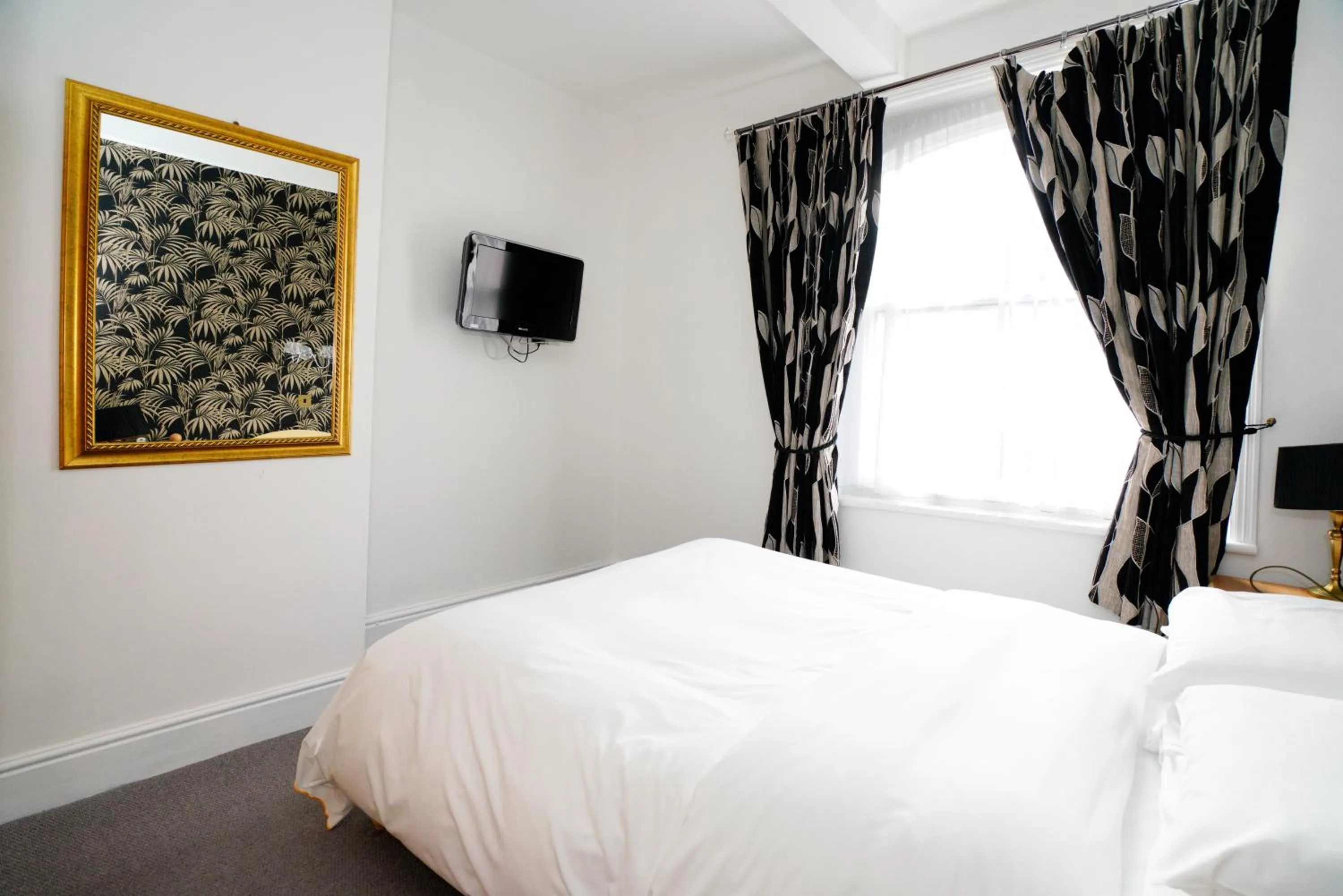 Bed in Three Queens Hotel