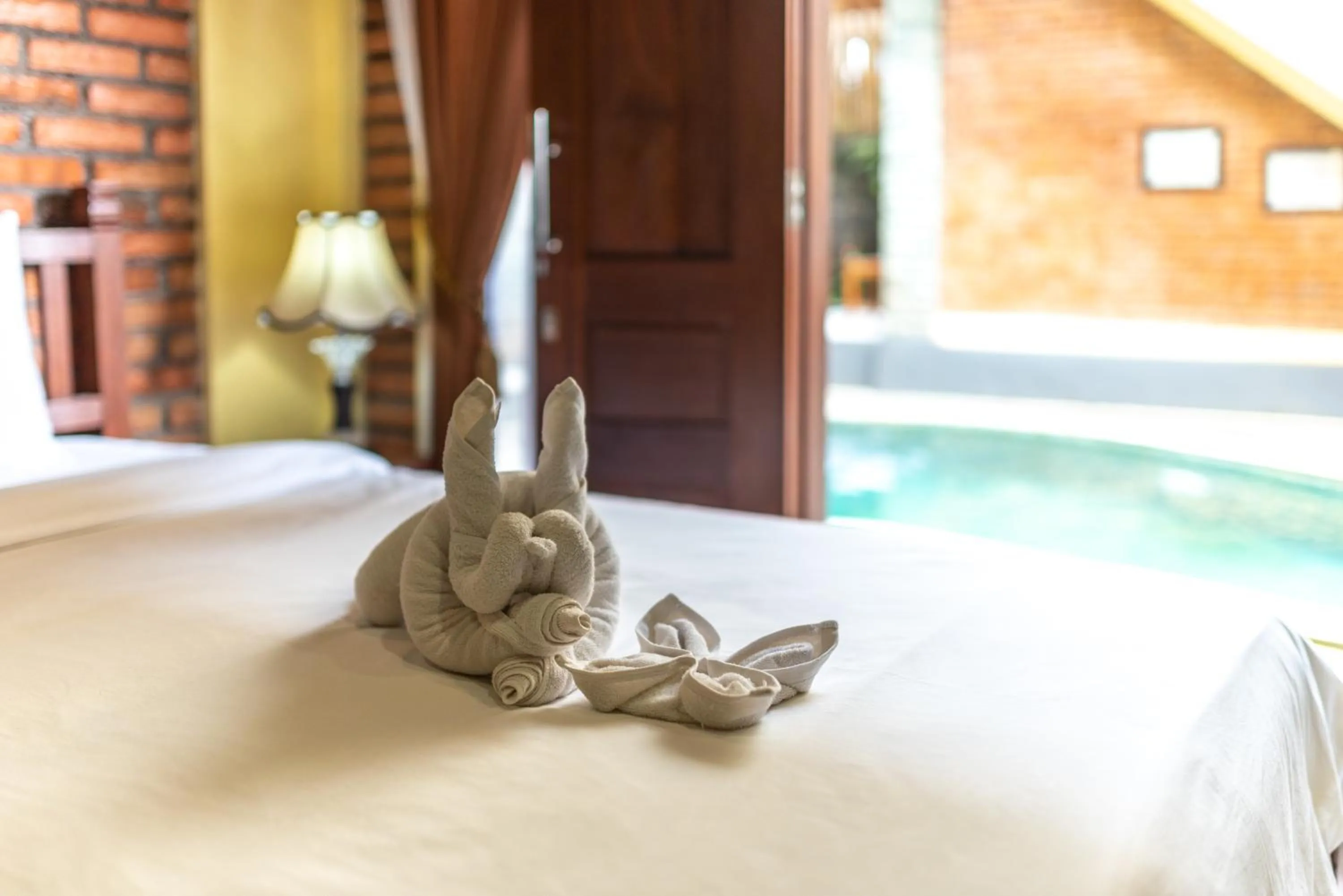 Bed in The Garuda Villa and Restaurant