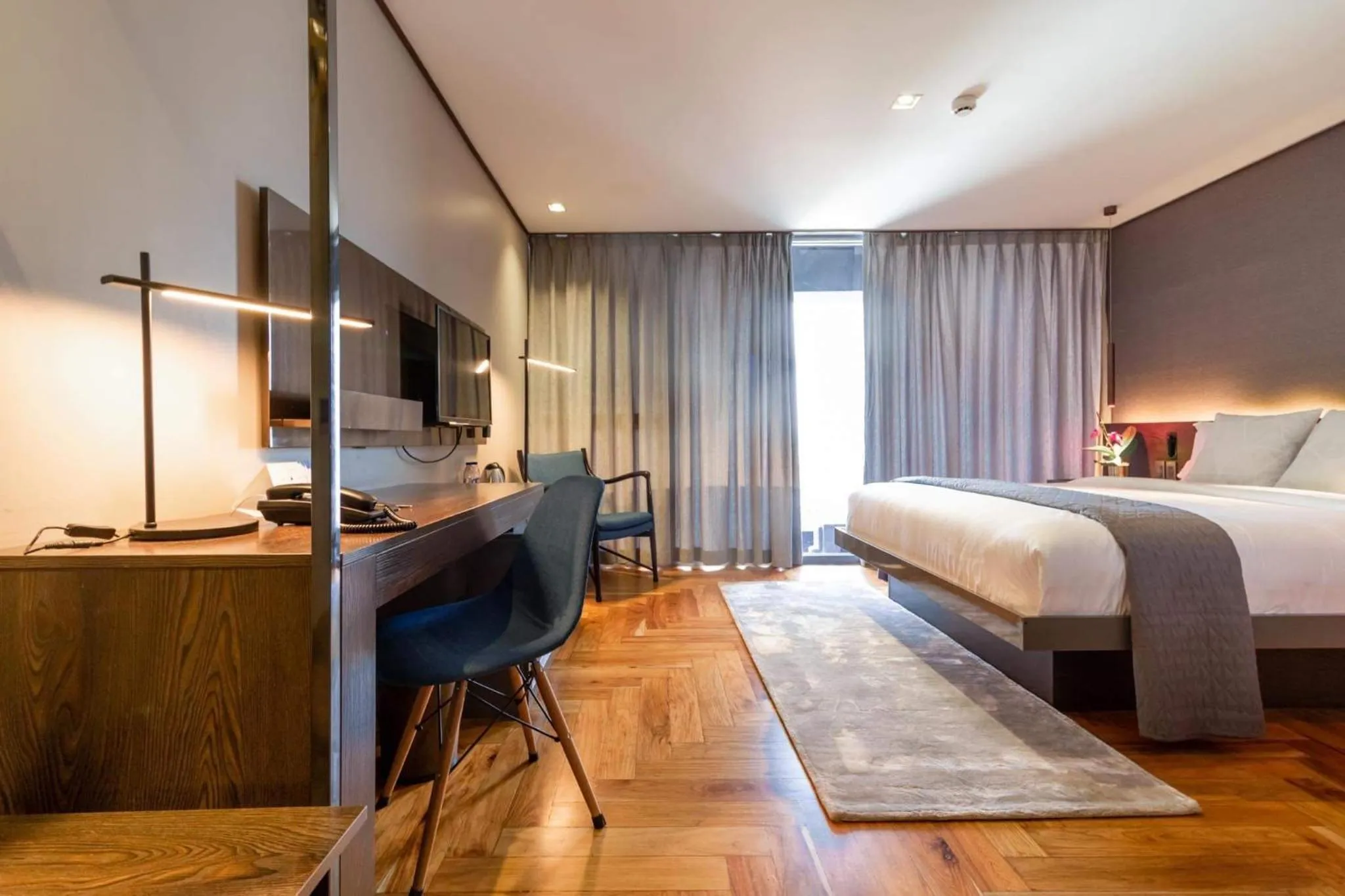 Bed in Ramada Encore by Wyndham Makati