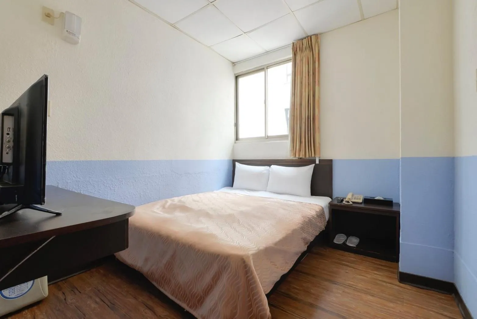 Bed in Blue Ocean Hotel