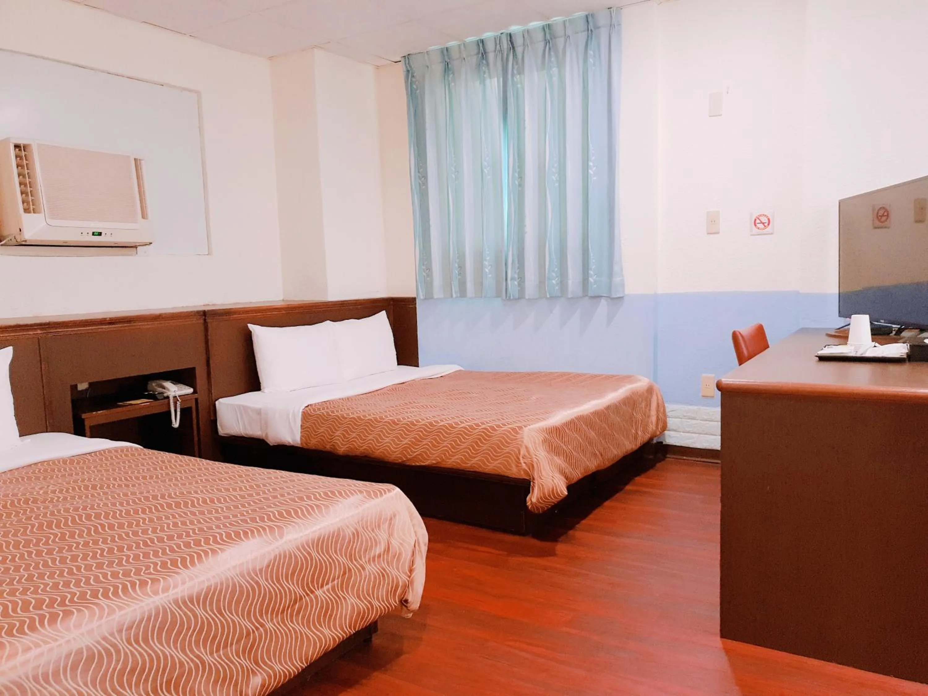 Bed in Blue Ocean Hotel