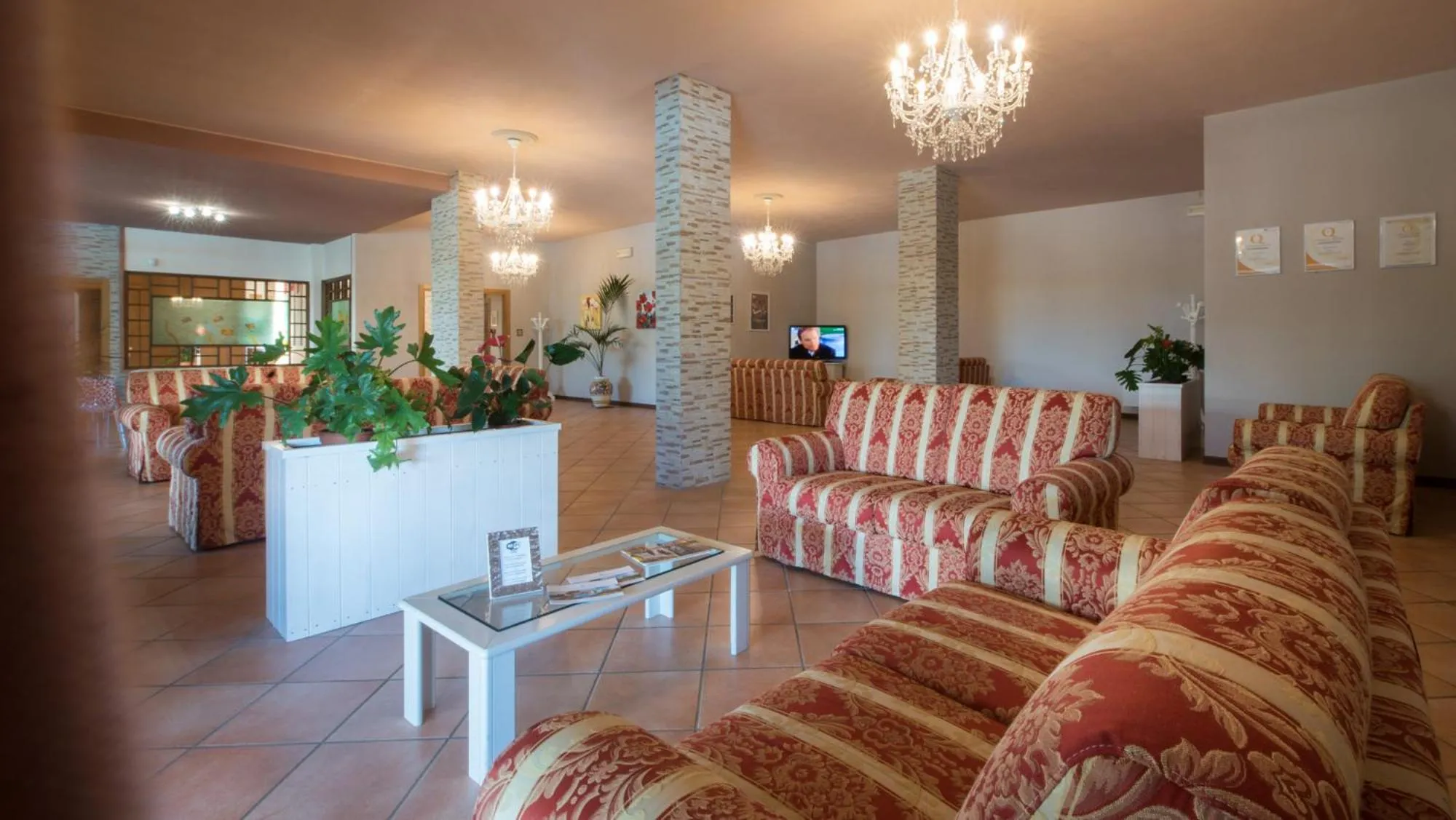 Communal lounge/ TV room in Hotel Torricella