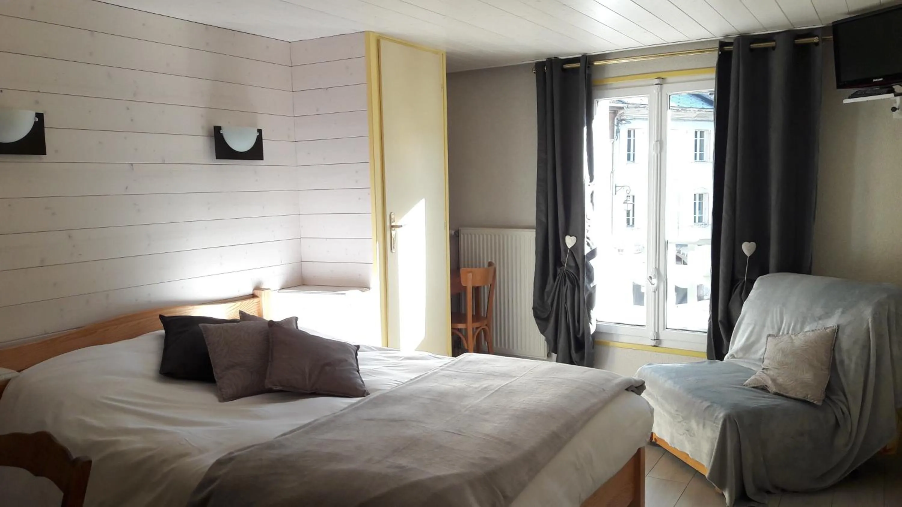 Photo of the whole room, Bed in Hôtel Du Midi