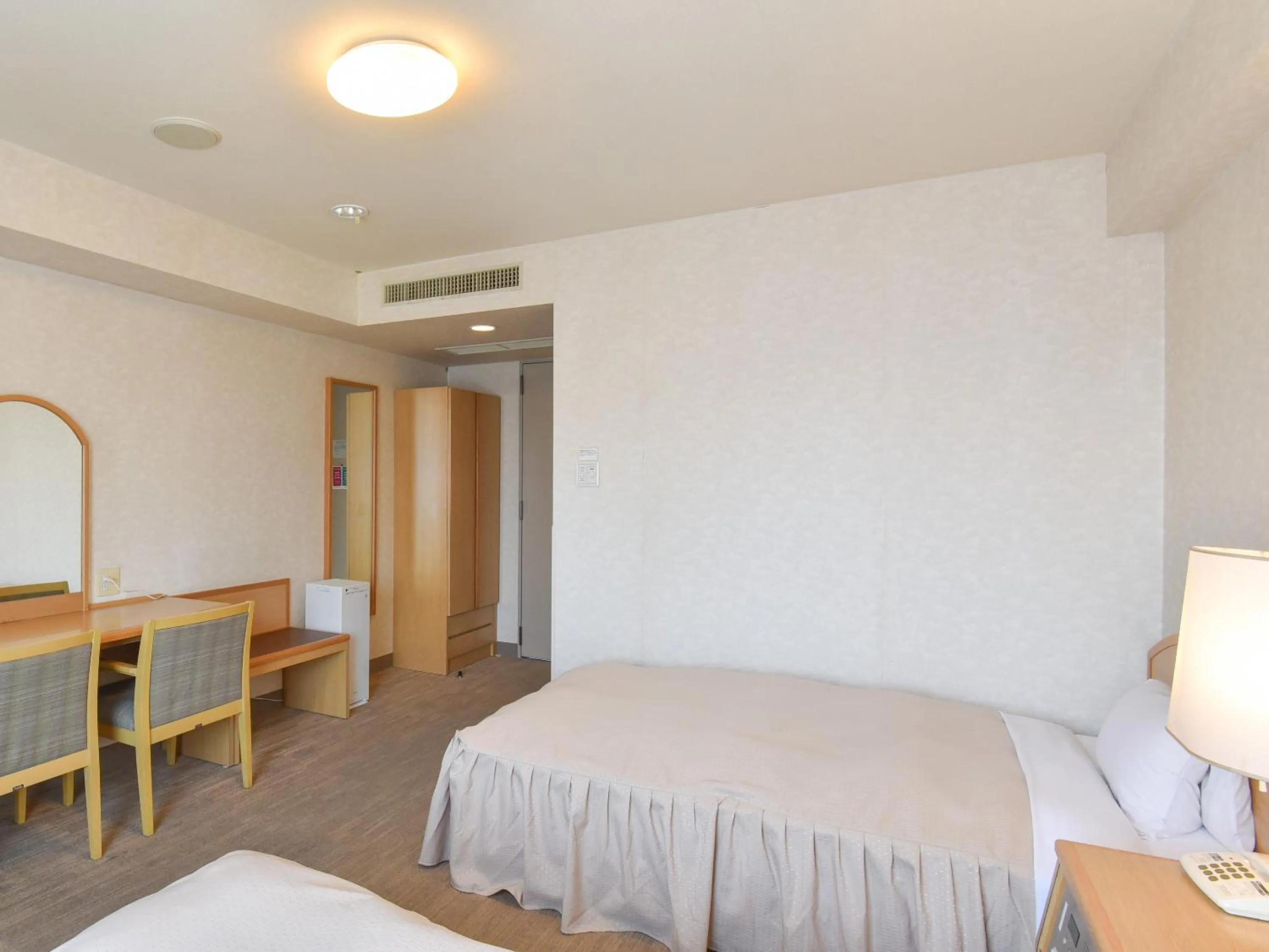 Bed in Yokkaichi City Hotel Annex