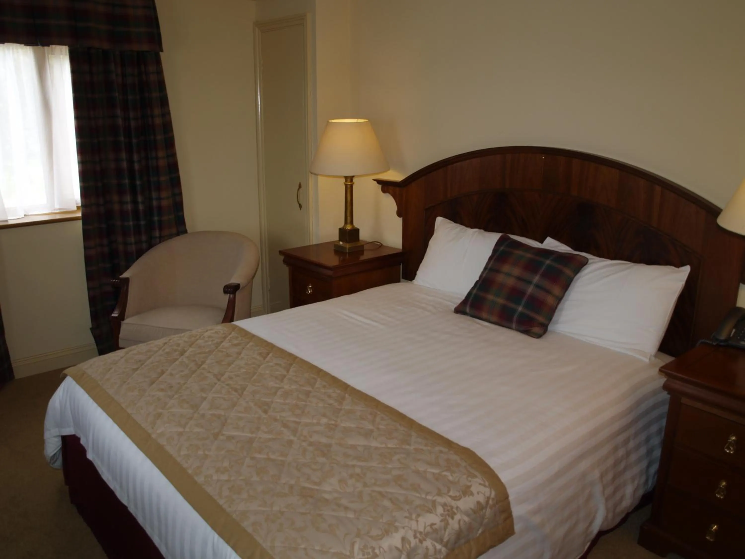 Bed in The Olde Windmill Inn