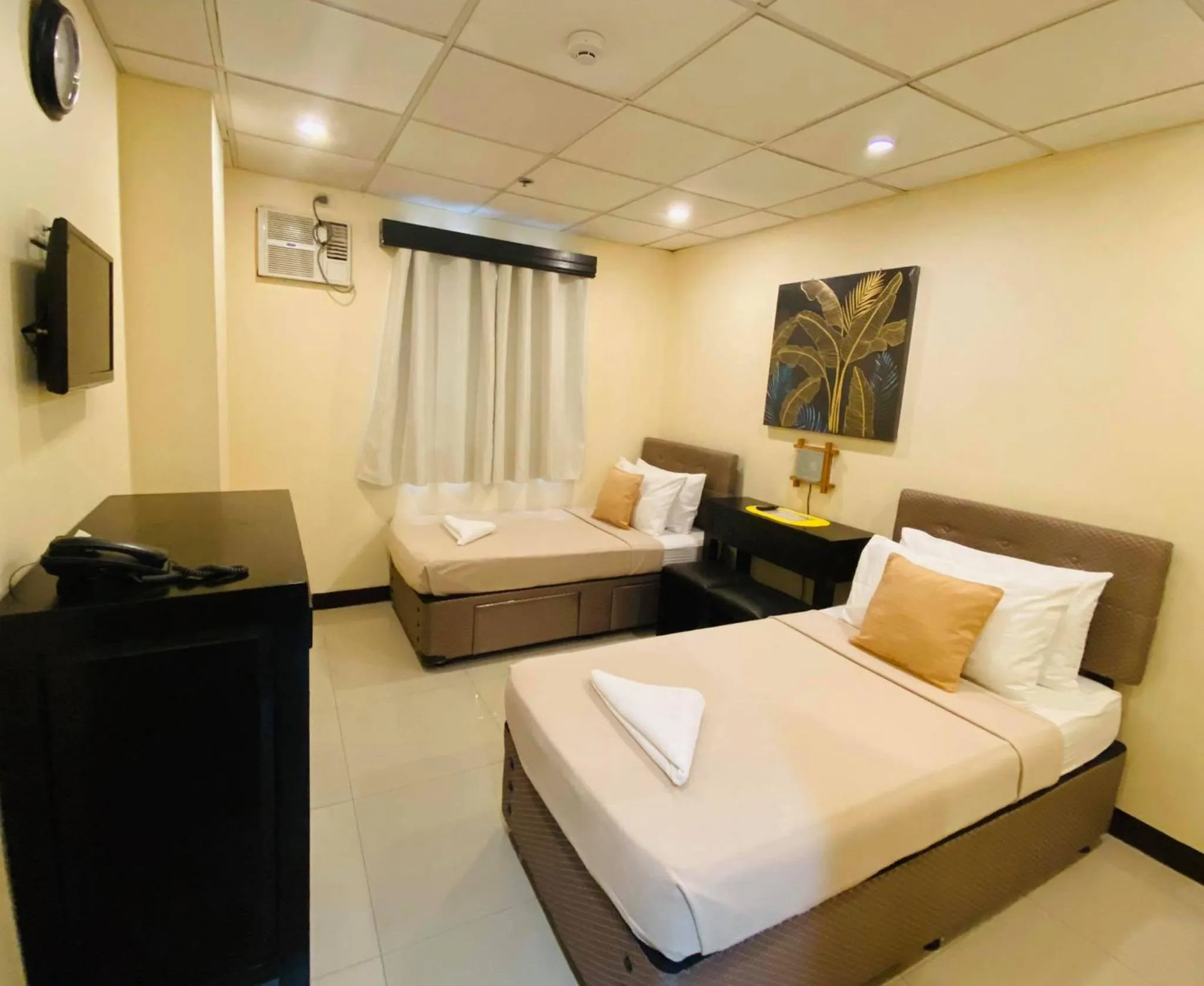 Bed in Amax Inn Makati