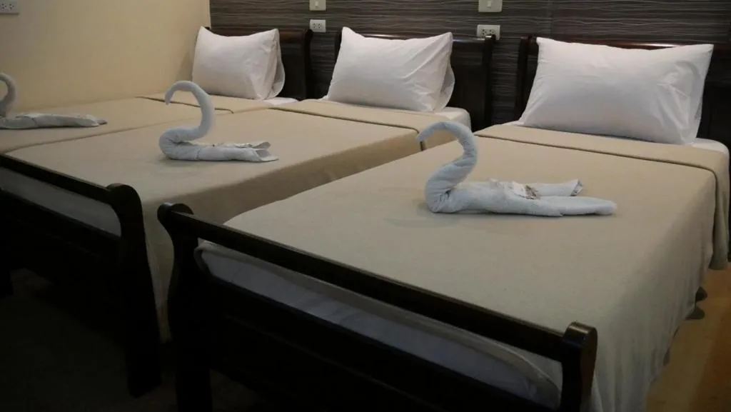 Bed in Amax Inn Makati