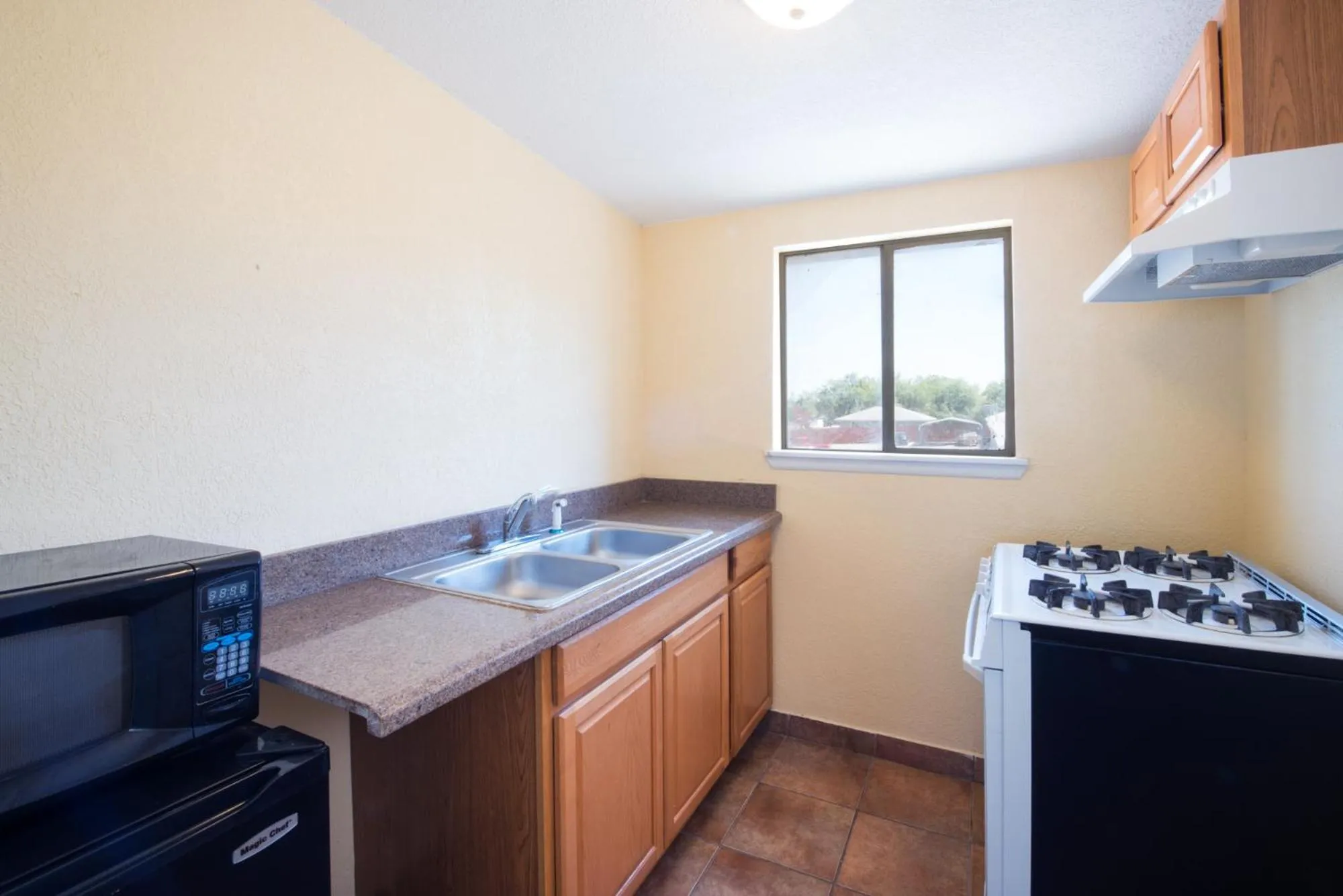 Bedroom in Executive Inn & Kitchenette Suites-Eagle Pass