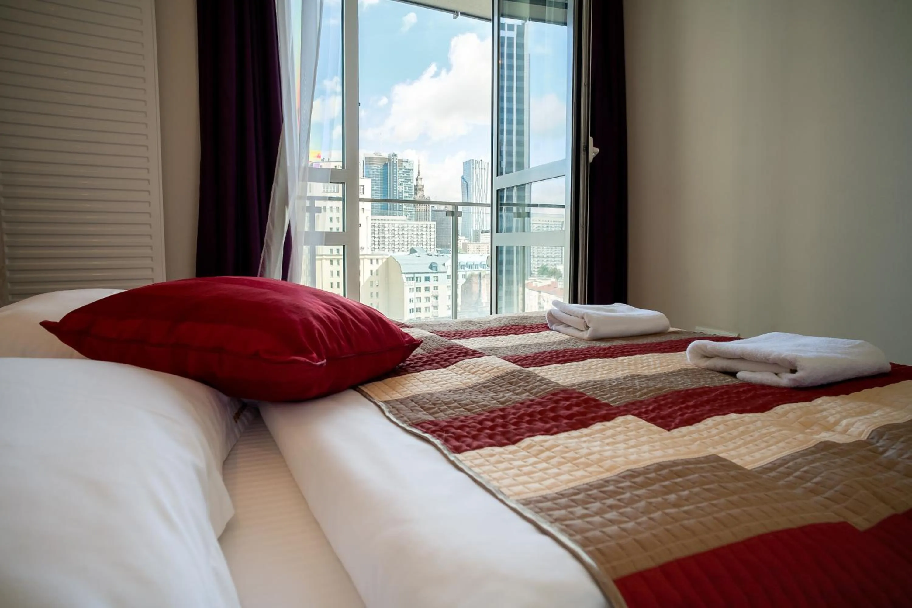 Bed in Platinum Towers E-Apartments