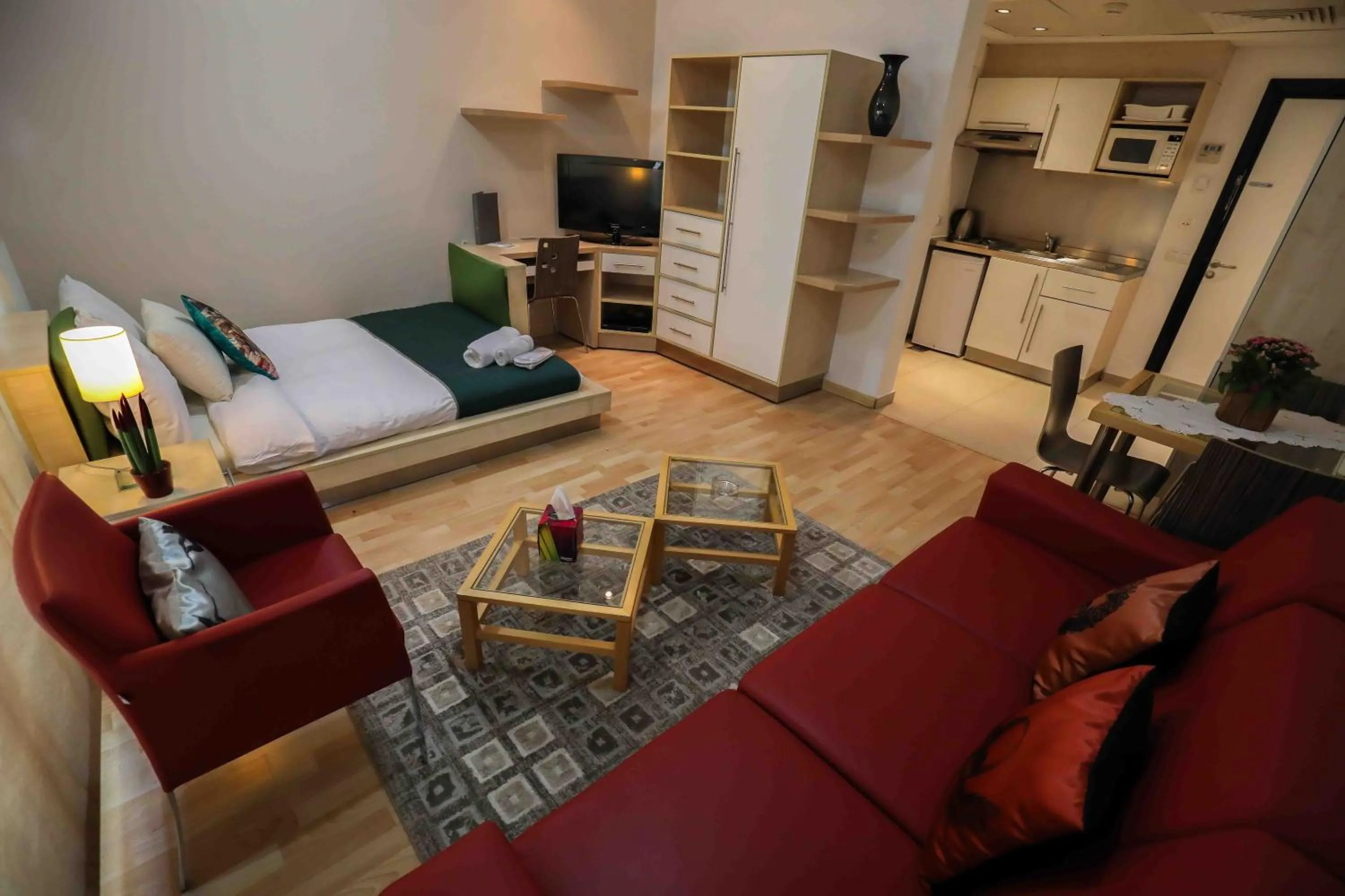 Seating area, Bed in Sky Suites