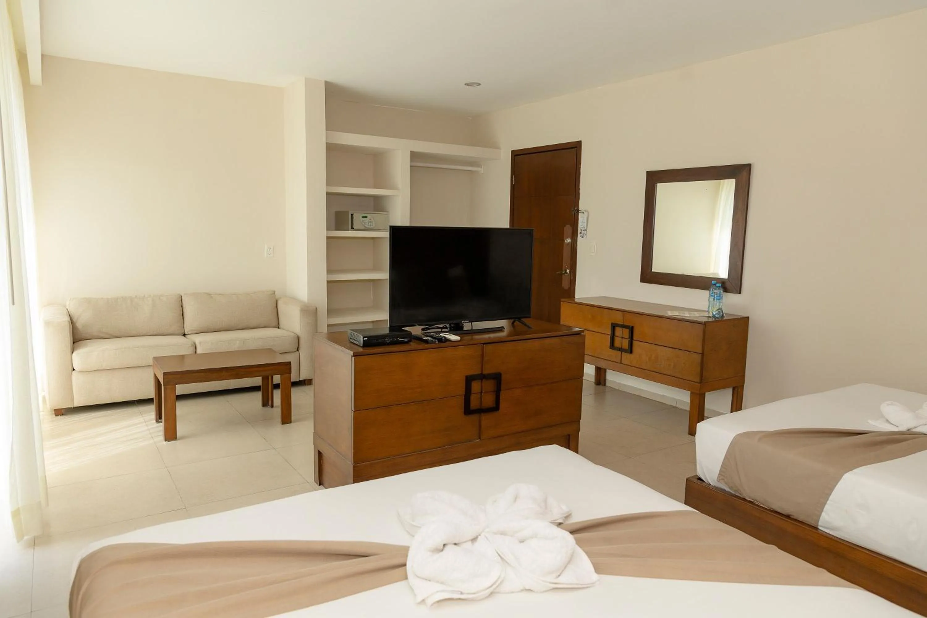 Living room, Bed in Quinto Sole Boutique Hotel Mahahual