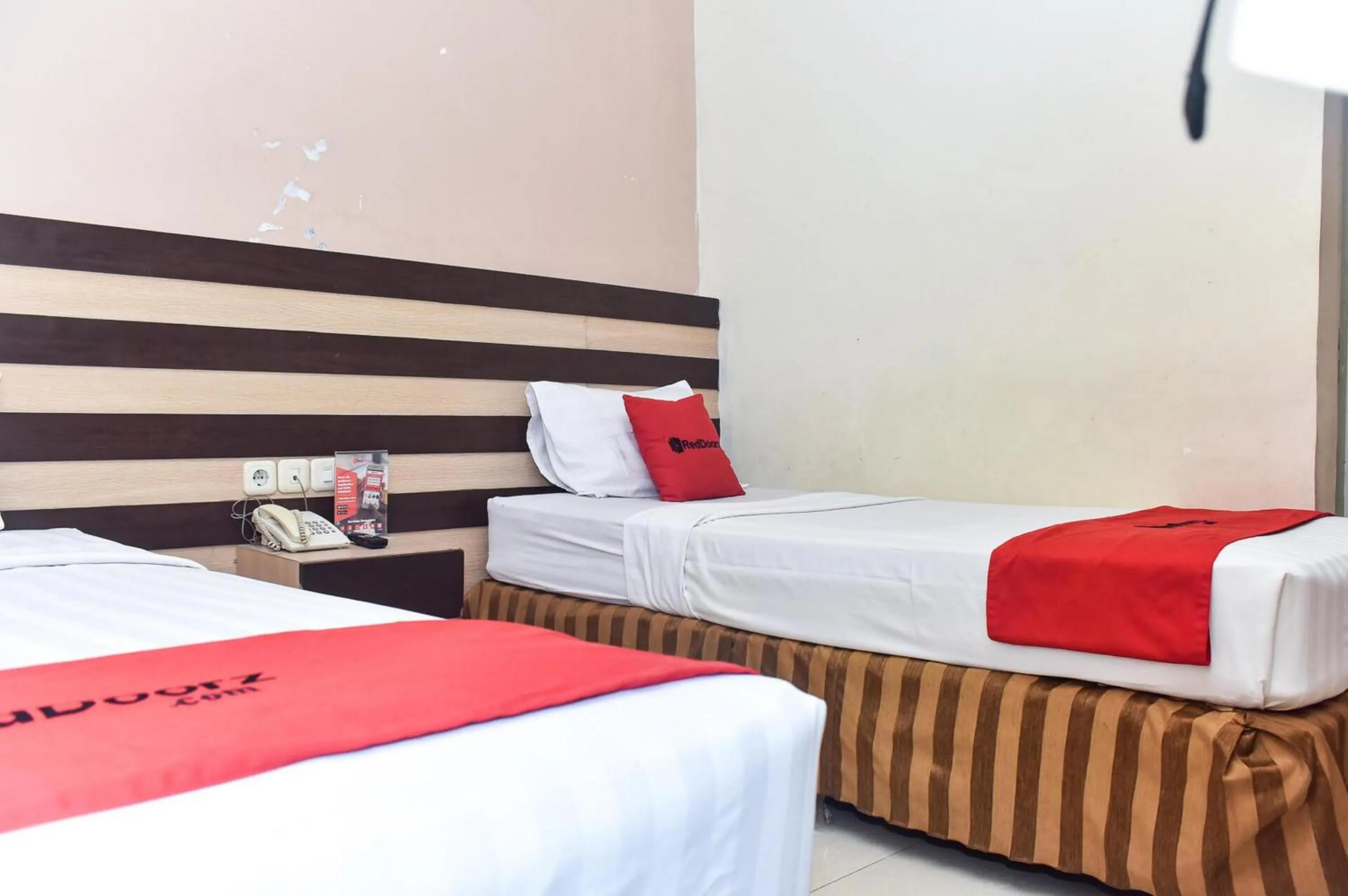 Bedroom, Bed in Reddoorz Plus near Makassar Town Square