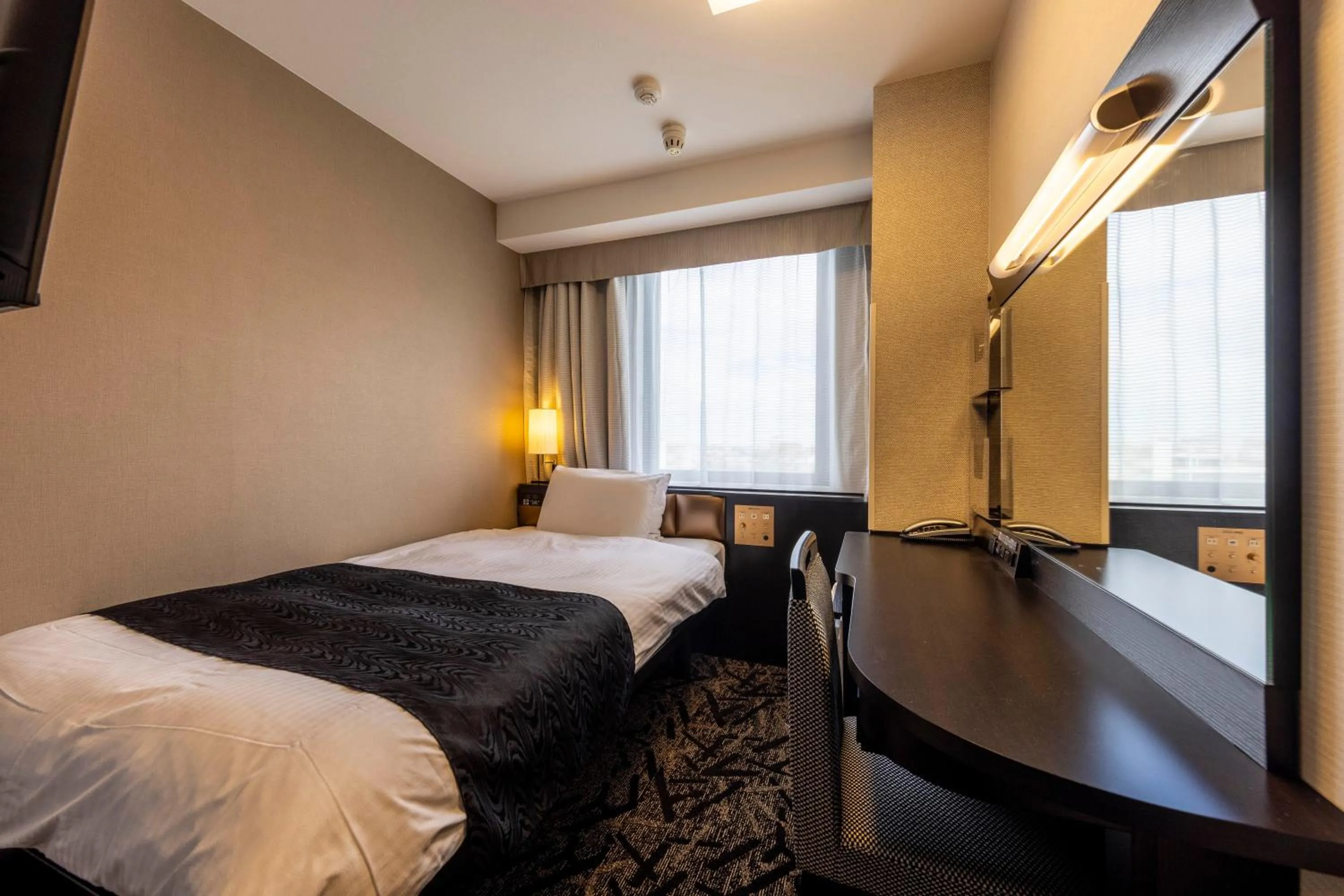 Photo of the whole room, Bed in APA Hotel Komatsu Grand