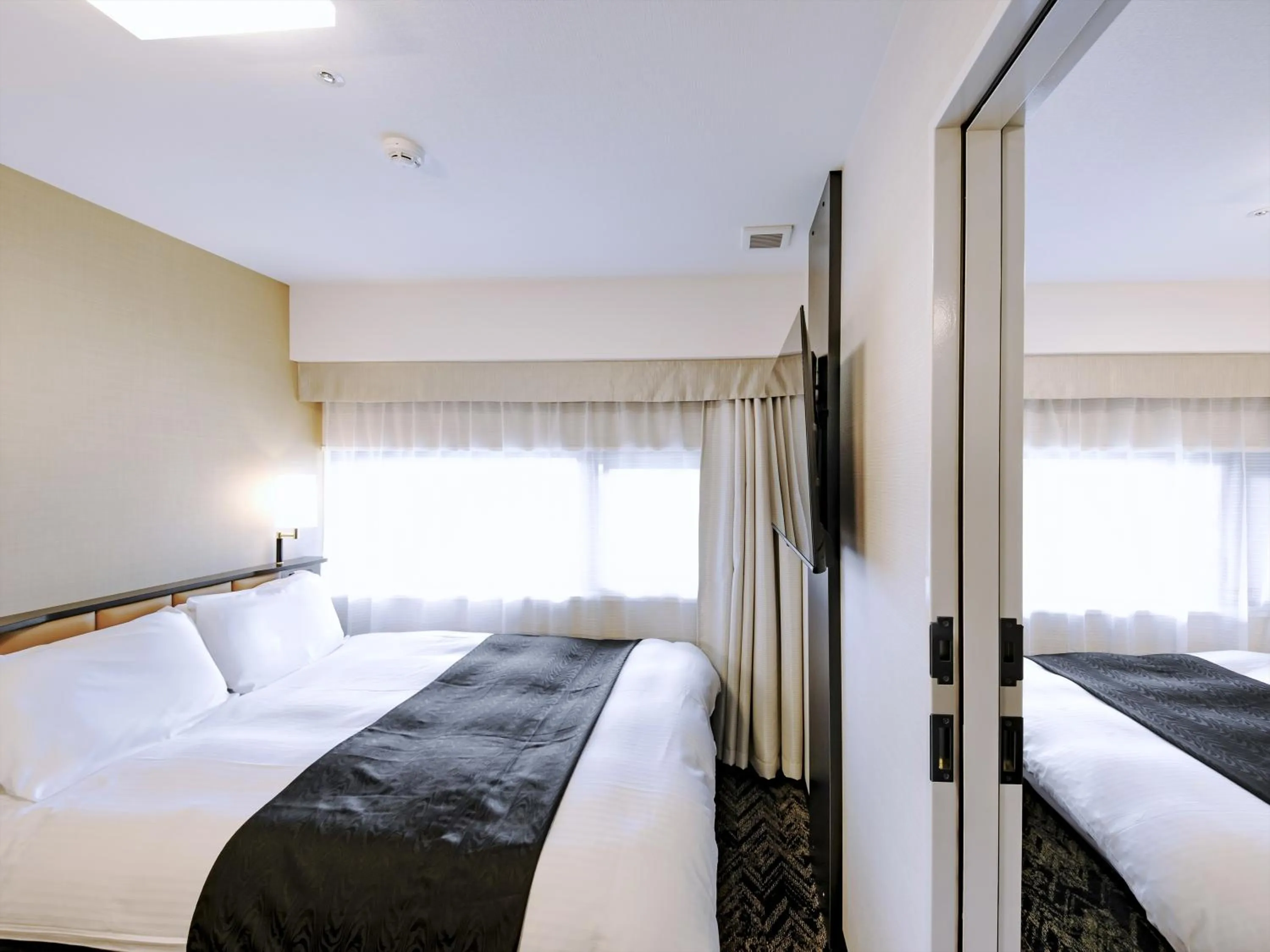 Photo of the whole room, Bed in APA Hotel Tottori Ekimae Minami