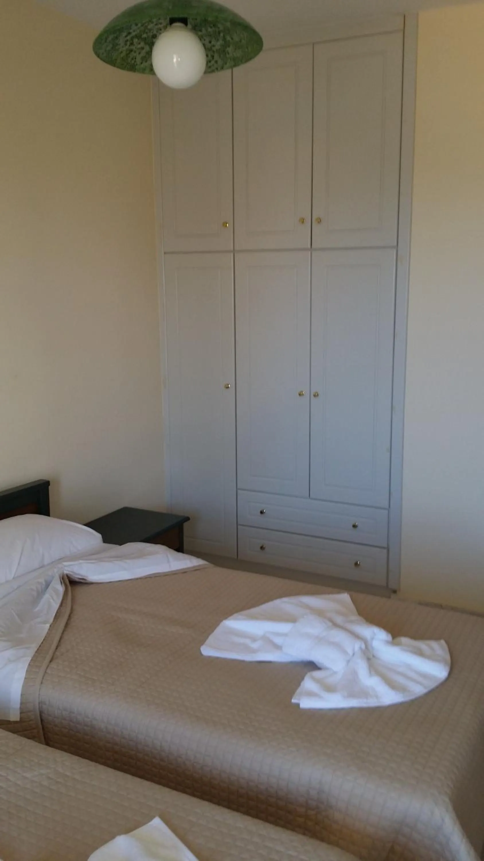 Bed in Mythos Beach Hotel Apartments