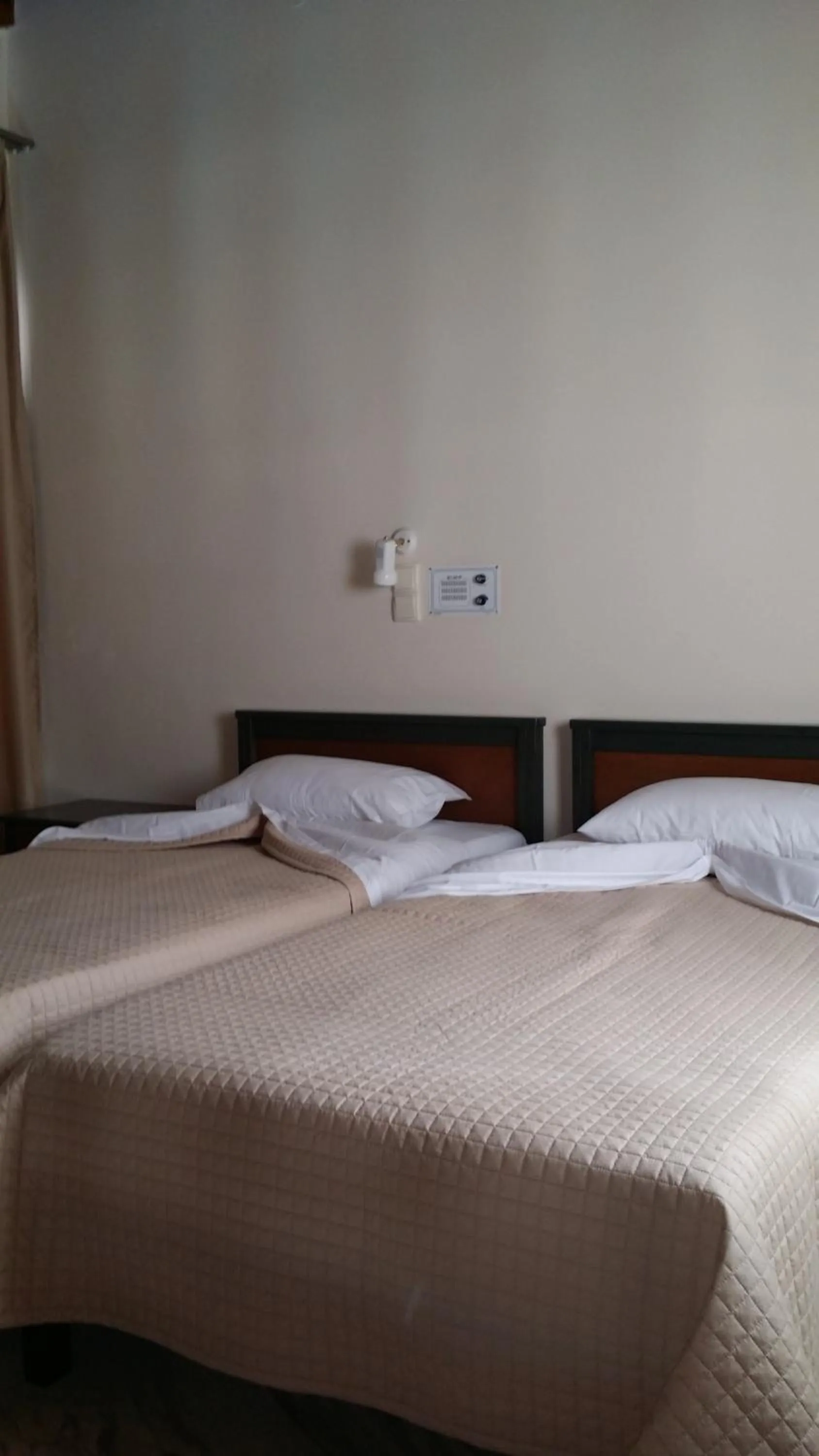 Bed in Mythos Beach Hotel Apartments