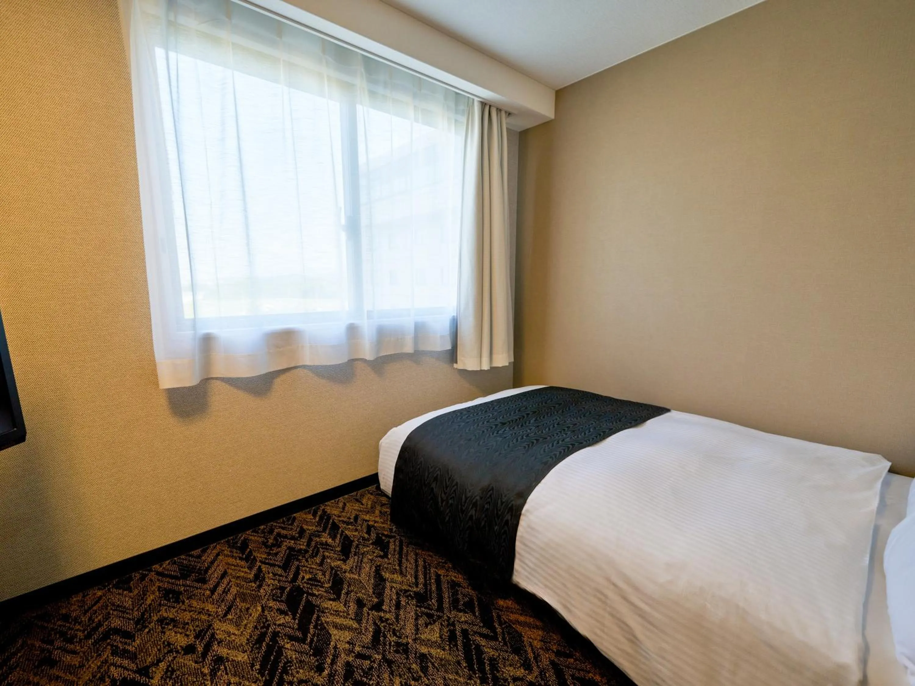 Photo of the whole room, Bed in APA Hotel Takamatsu Airport