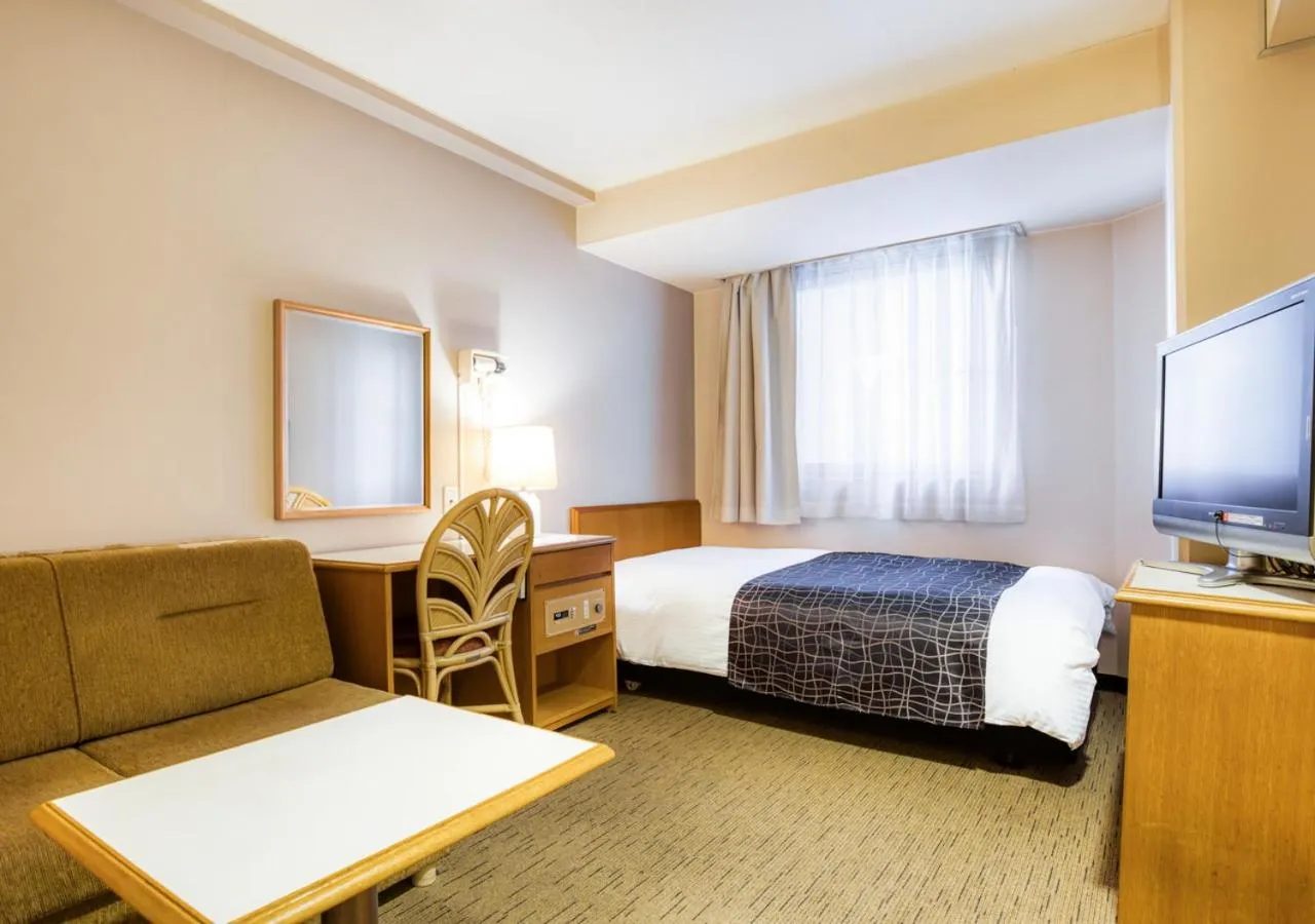 Photo of the whole room, Bed in APA Hotel Marugame Ekimae Odori