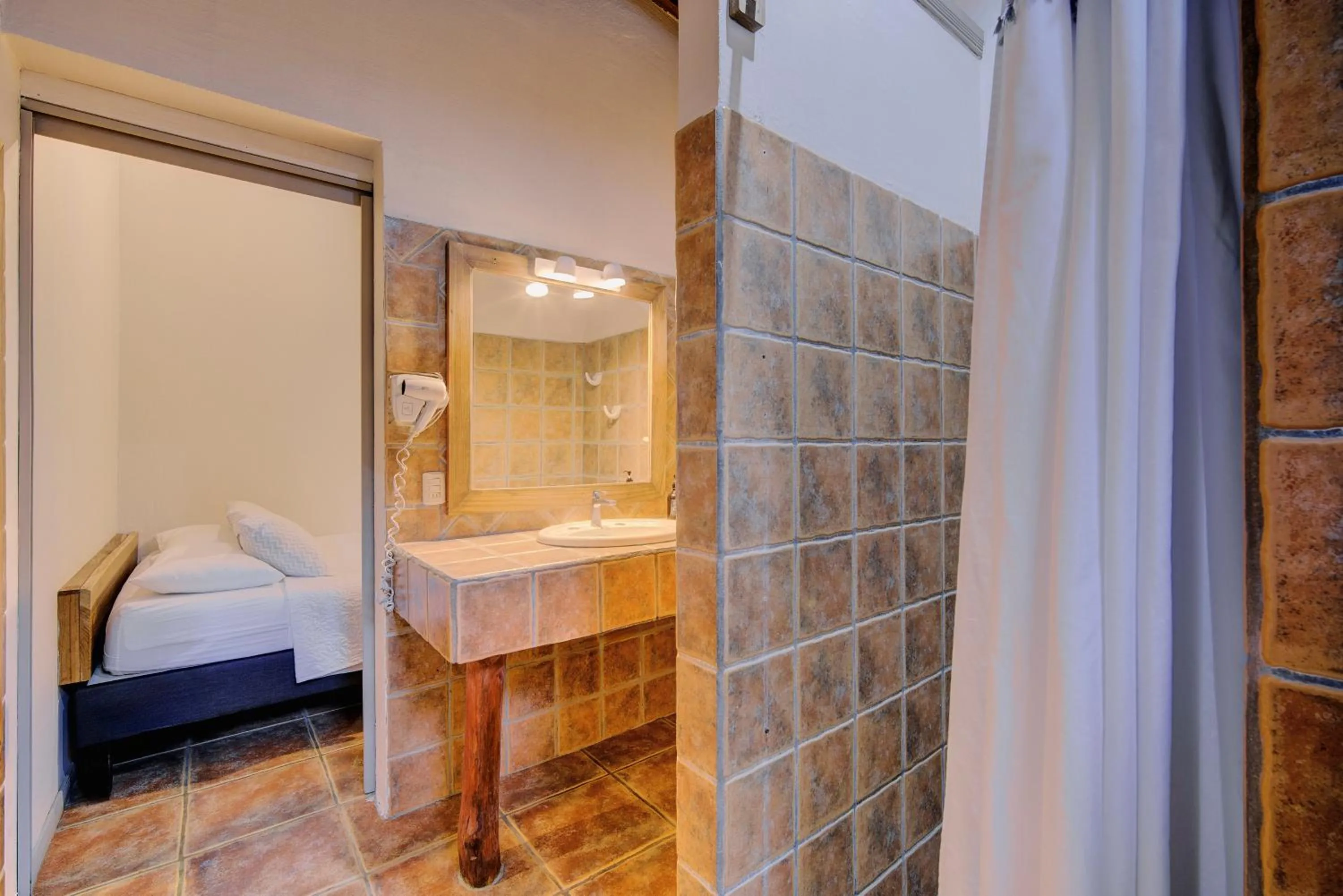 Bed in Cariblue Beach and Jungle Resort