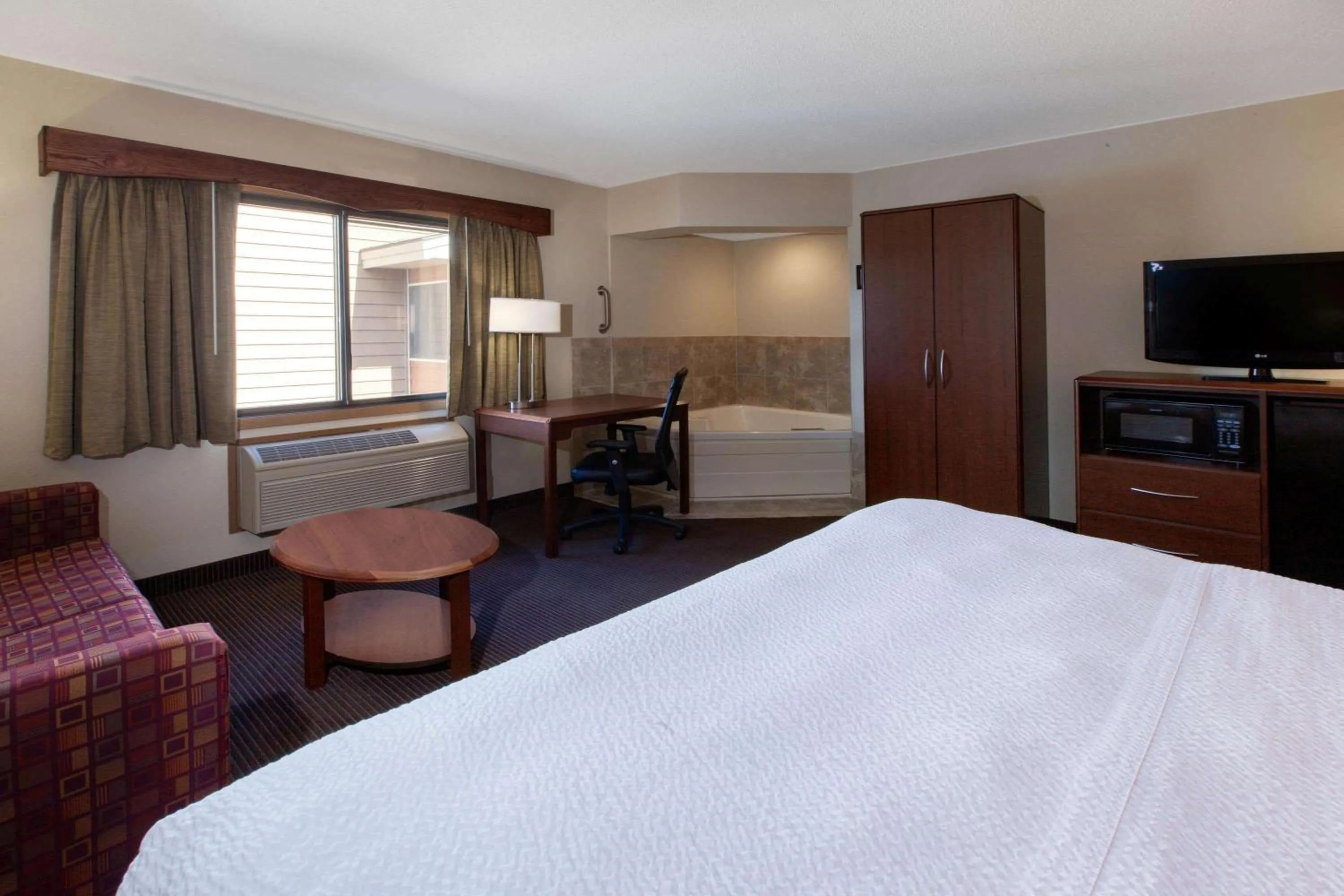 Photo of the whole room, Bed in AmericInn by Wyndham Iron River