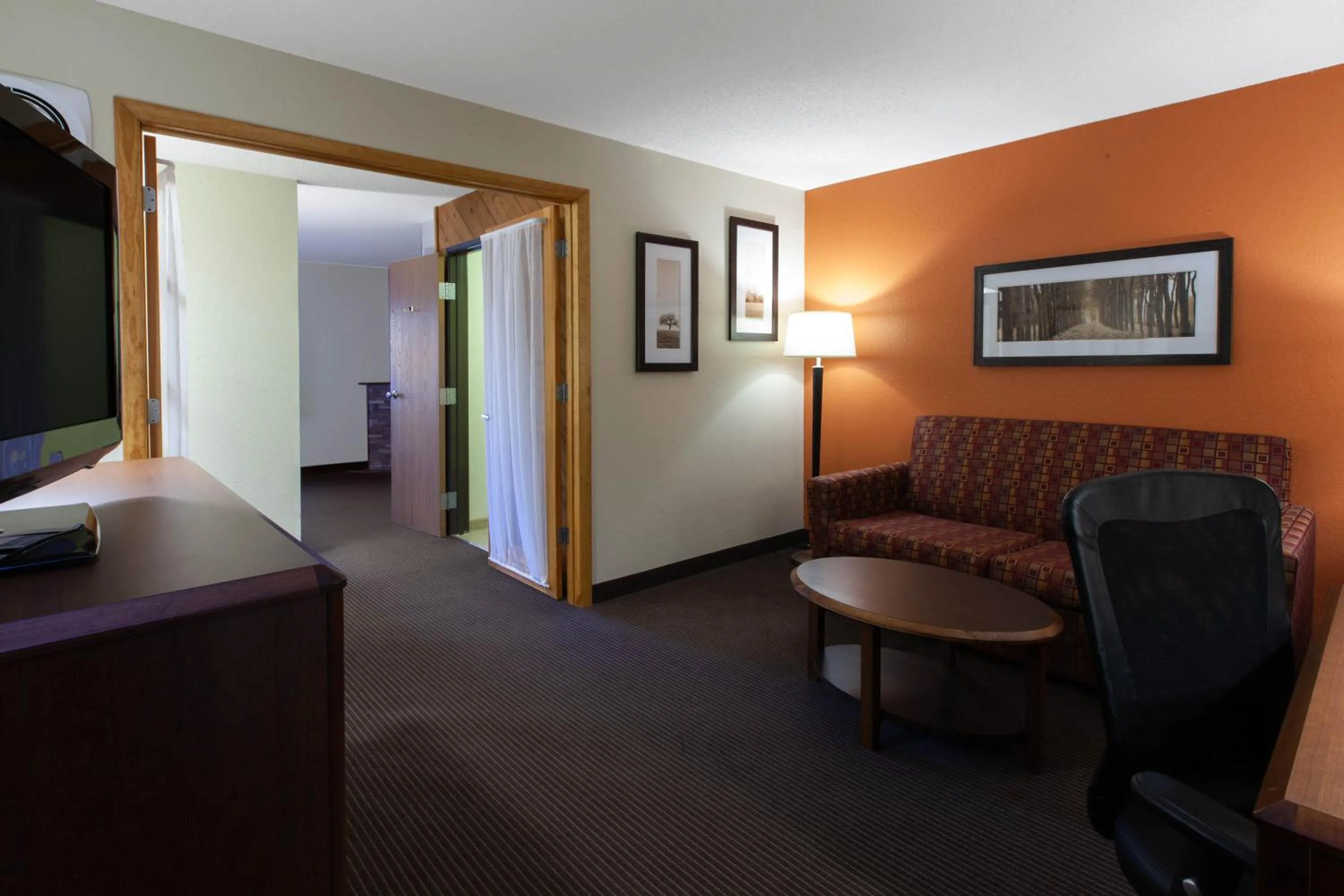 Living room in AmericInn by Wyndham Iron River