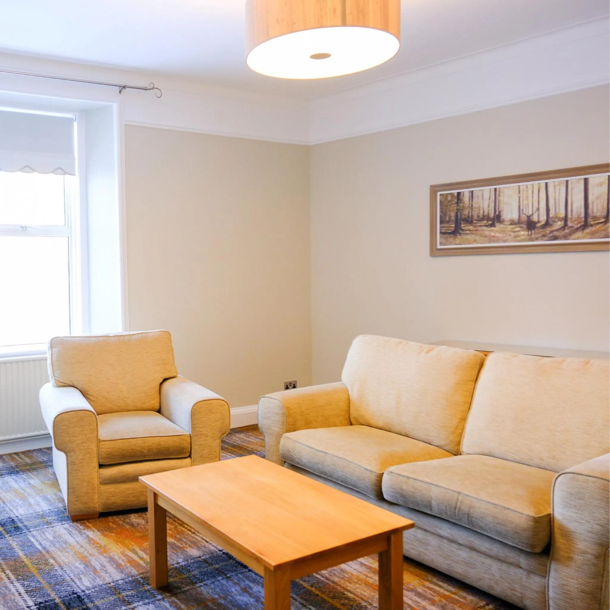 Living room in Glen Mhor Hotel at Uile-bheist 'Brewstillery'