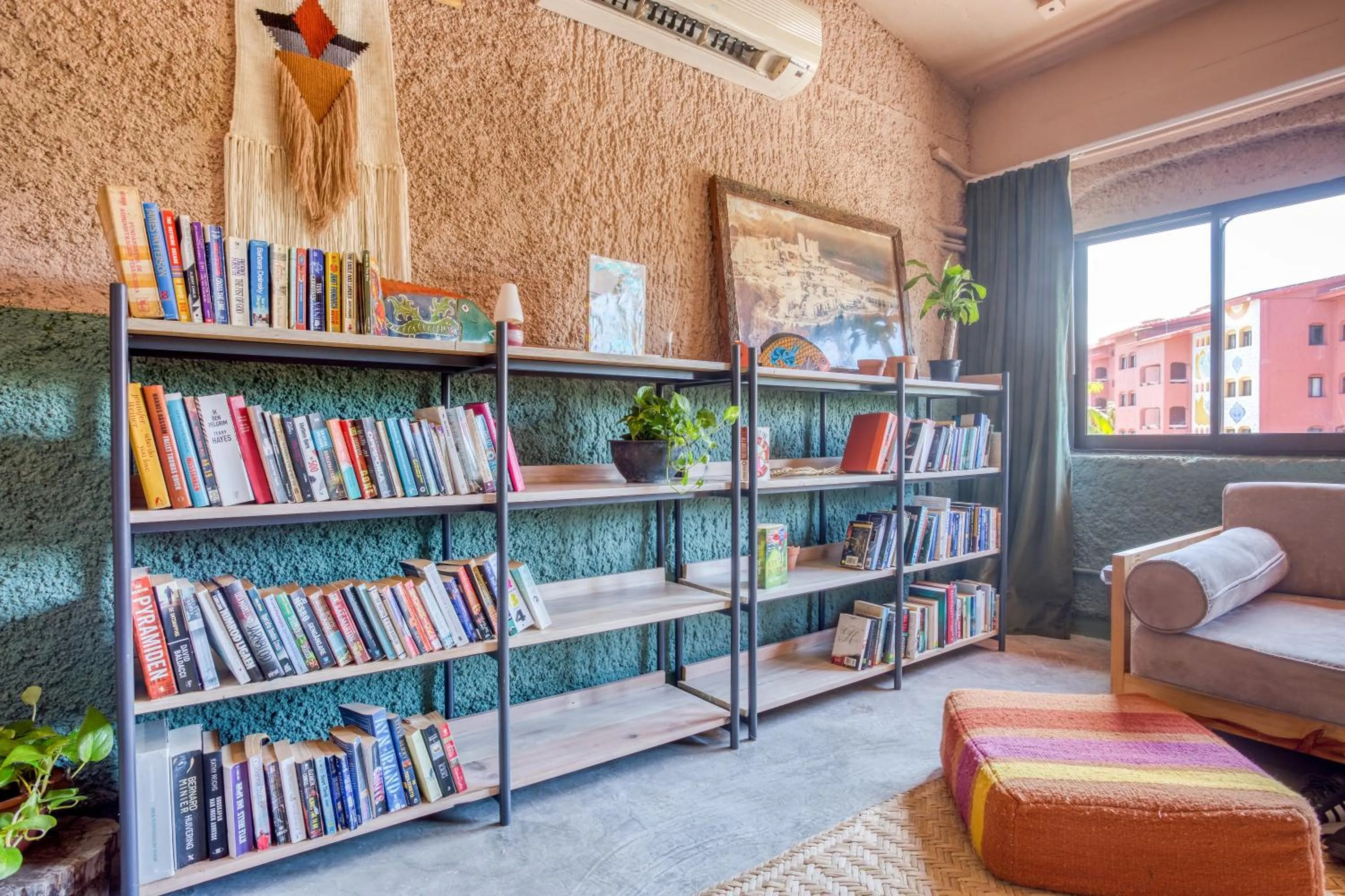 Library in Nílu Cancun Zona Hotelera by Selina