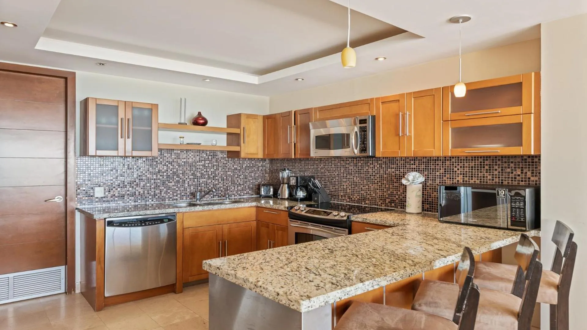 Kitchen or kitchenette in Encanto Living Two Bedroom Unit by Kivoya