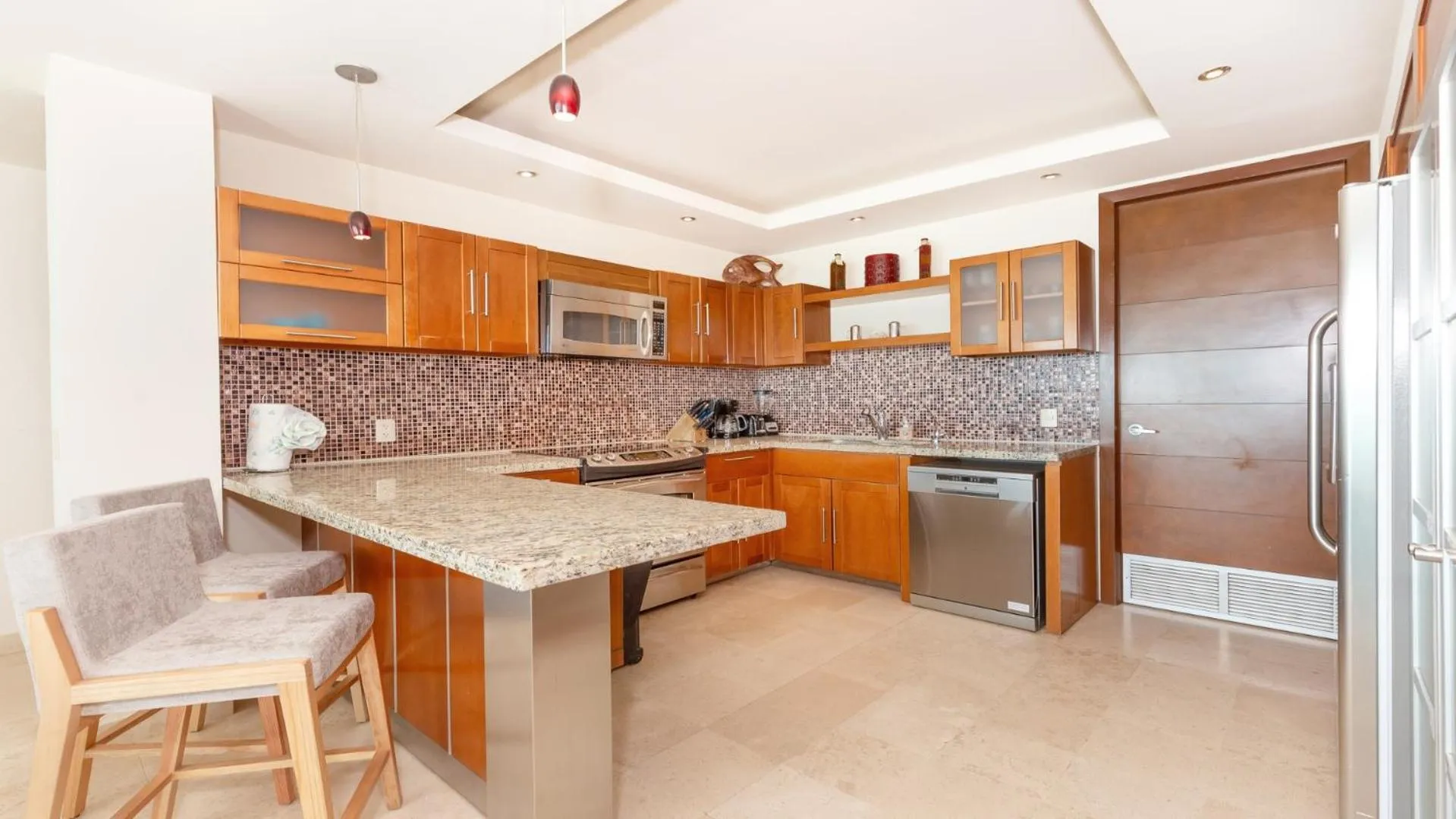 Kitchen or kitchenette in Encanto Living Two Bedroom Unit by Kivoya