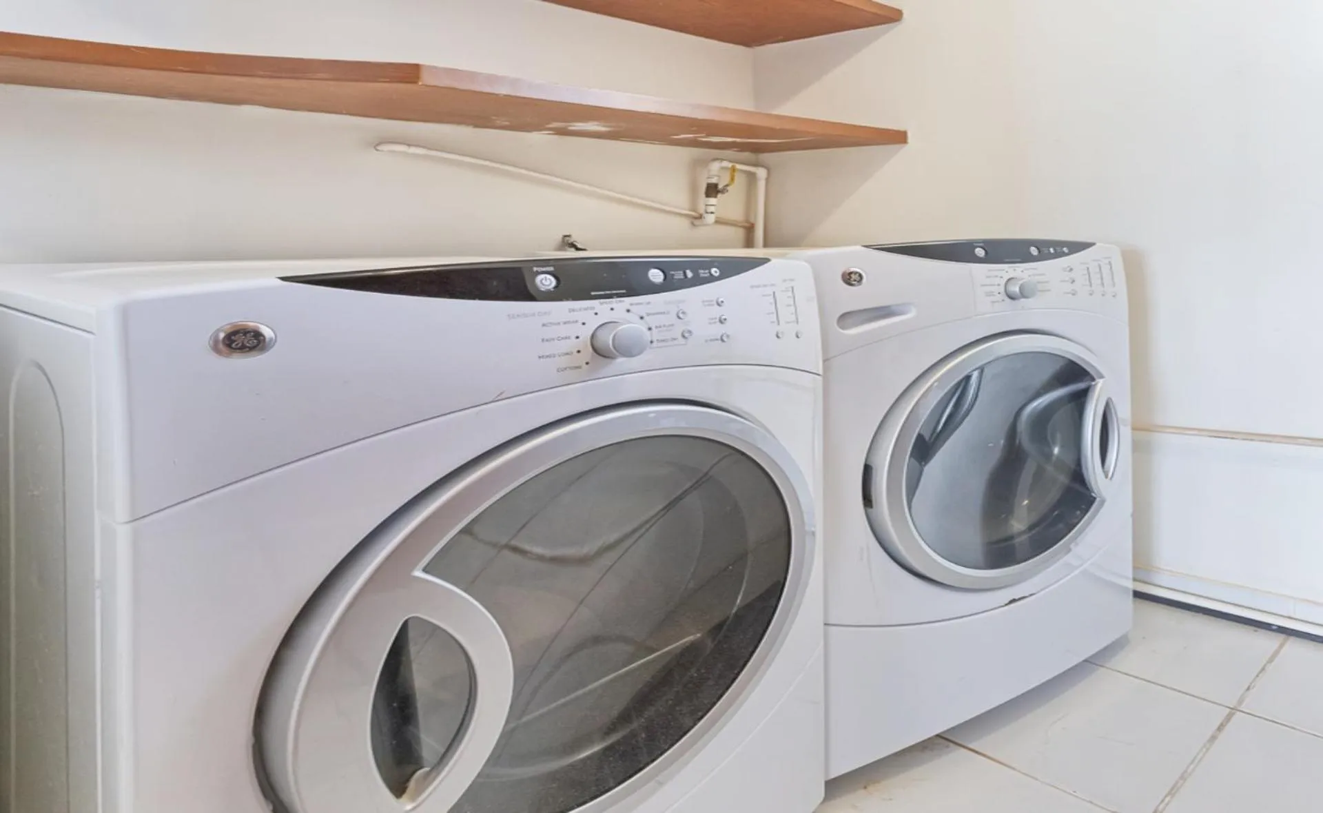 washing machine in Encanto Living Two Bedroom Unit by Kivoya