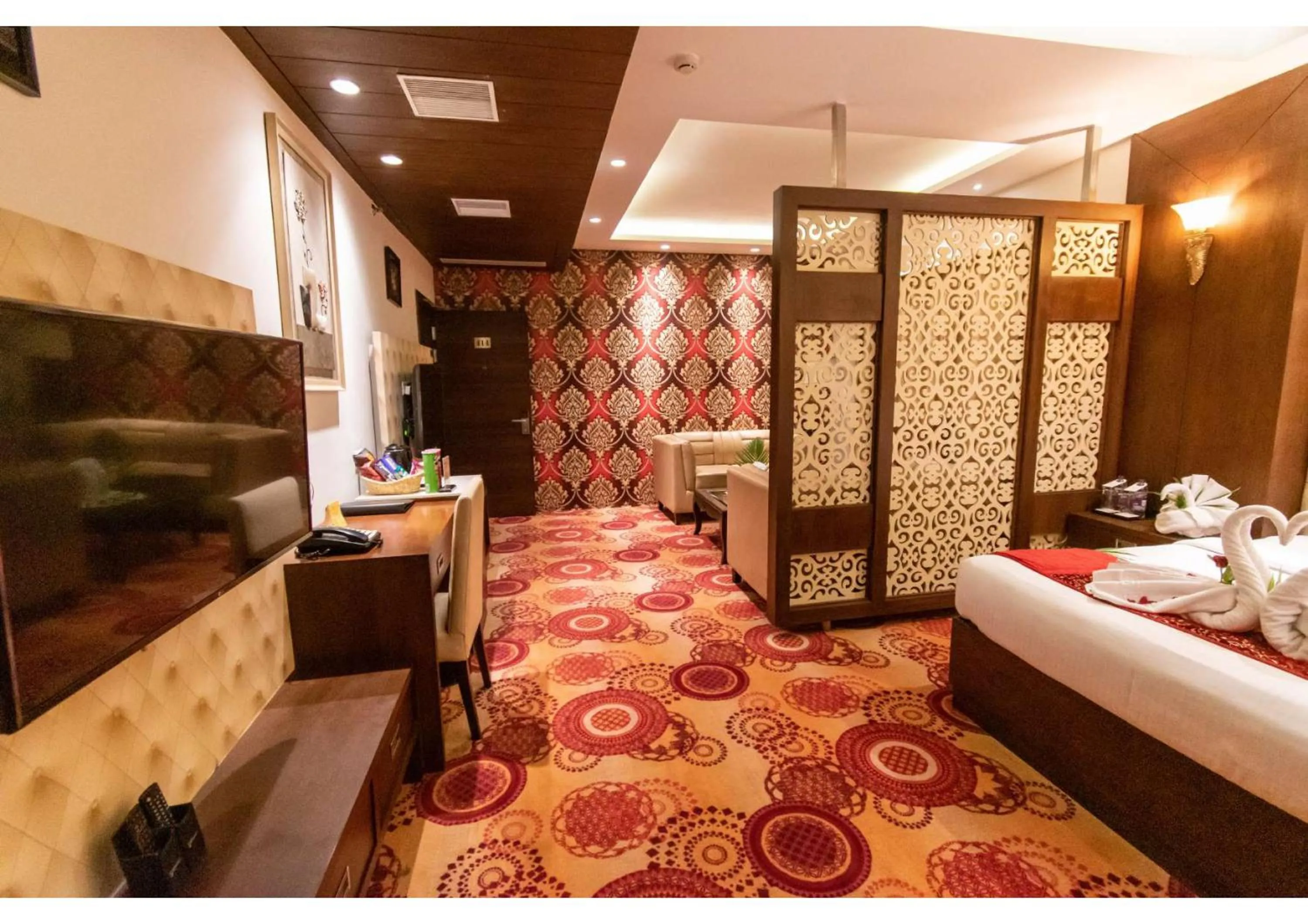 Living room, Bed in The Grand Ambassador