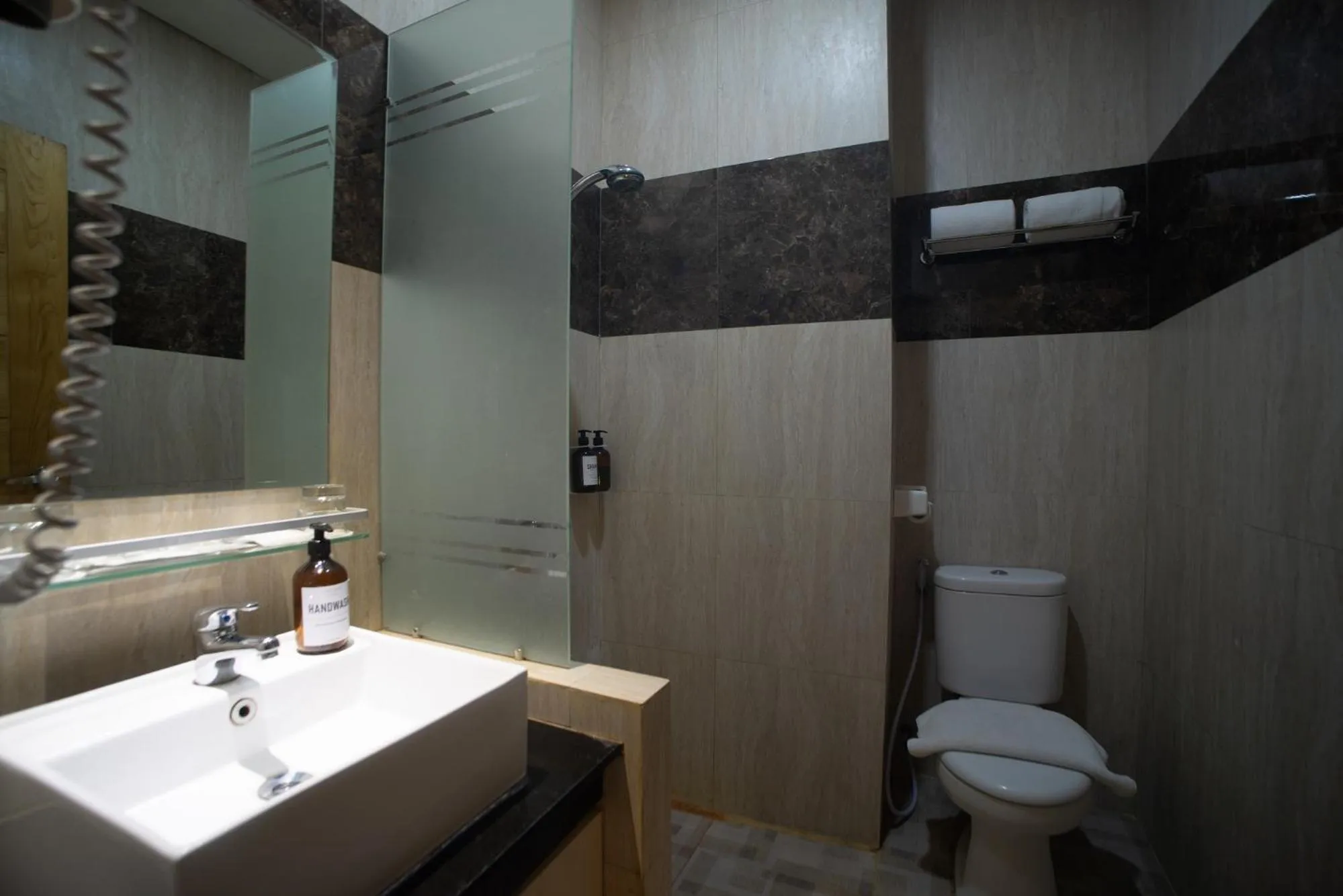 Bathroom in Luminor Hotel Banyuwangi By WH