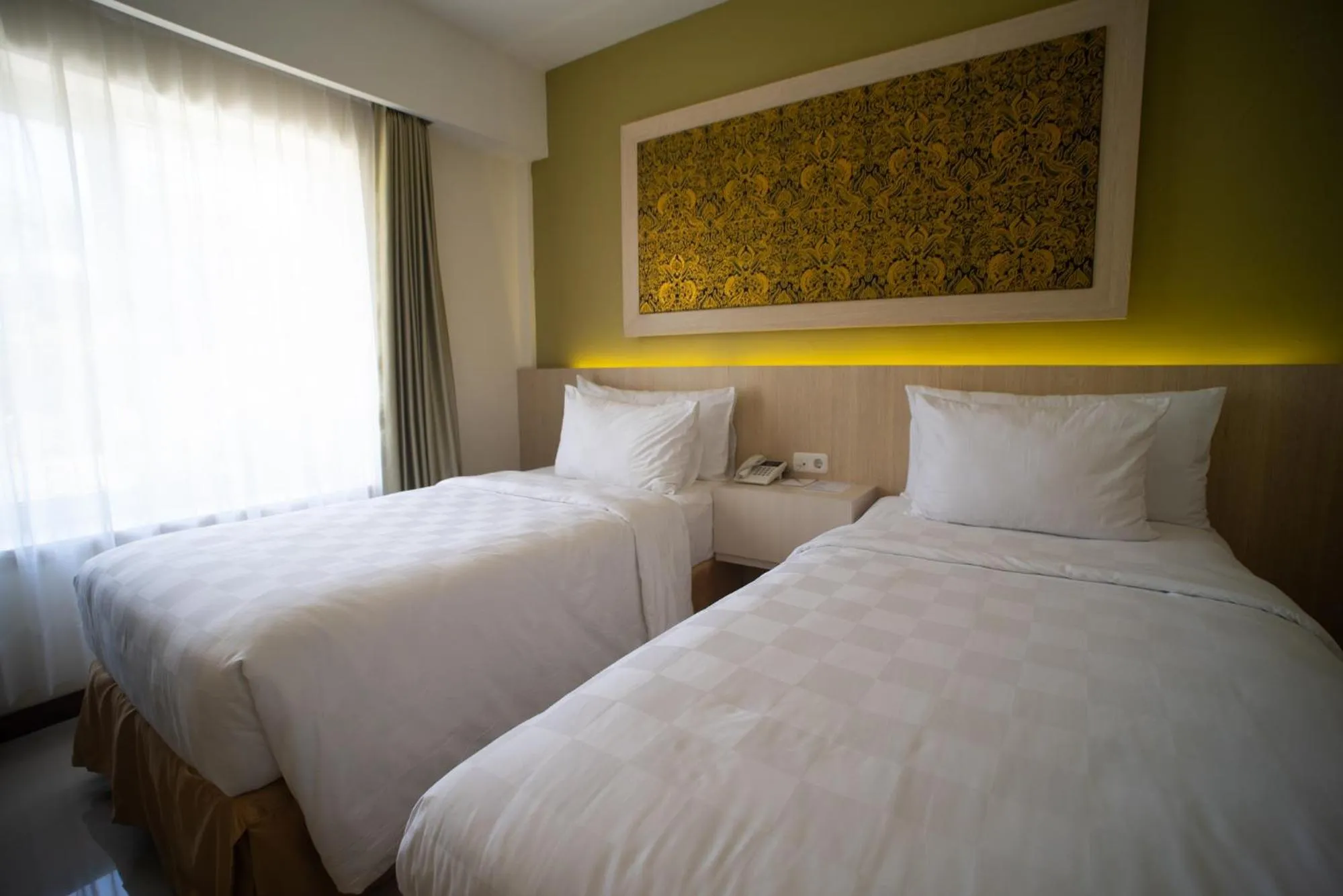 Bedroom, Bed in Luminor Hotel Banyuwangi By WH