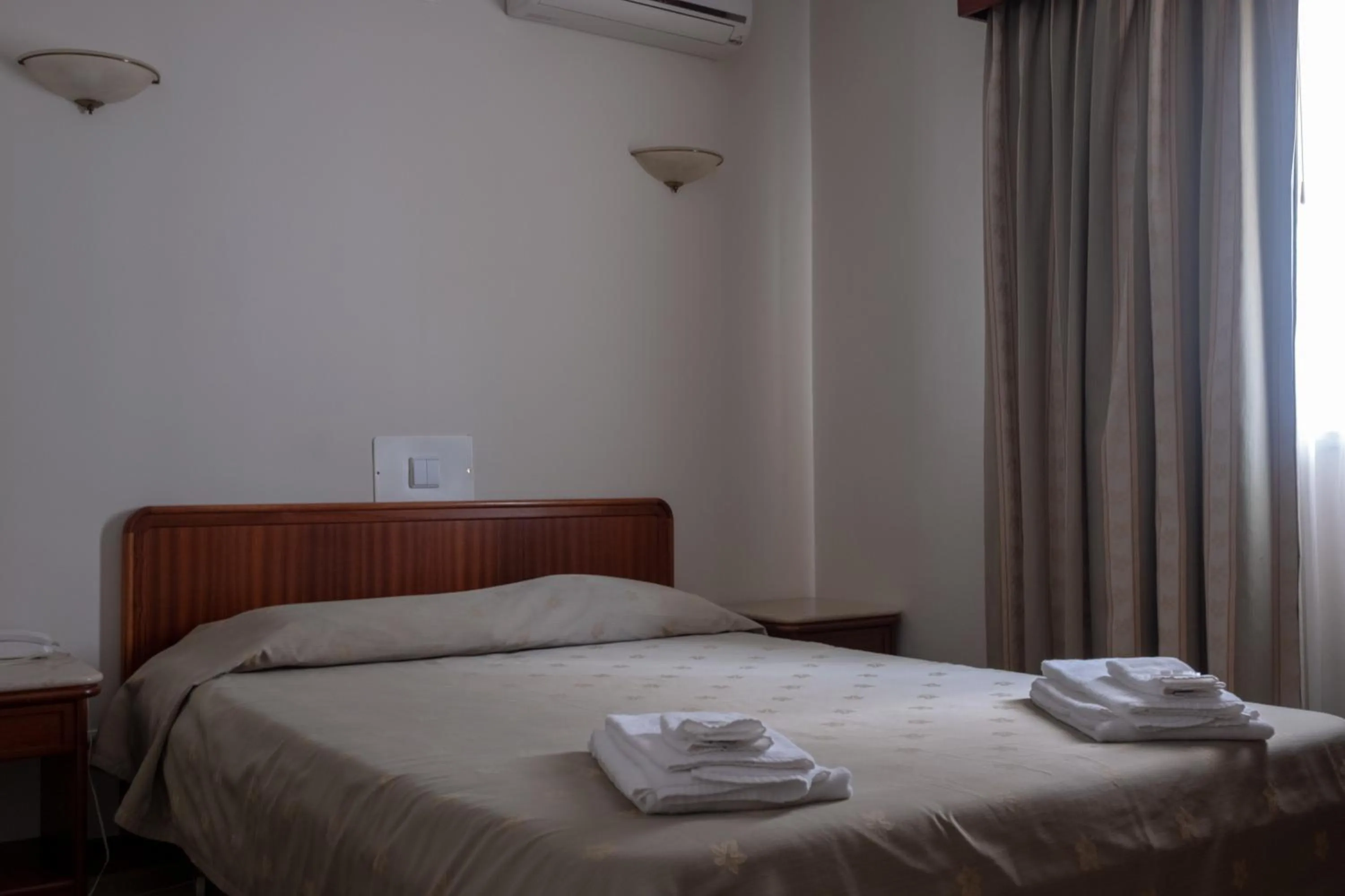 Bed in Hotel Peregrinos de Fatima by Umbral