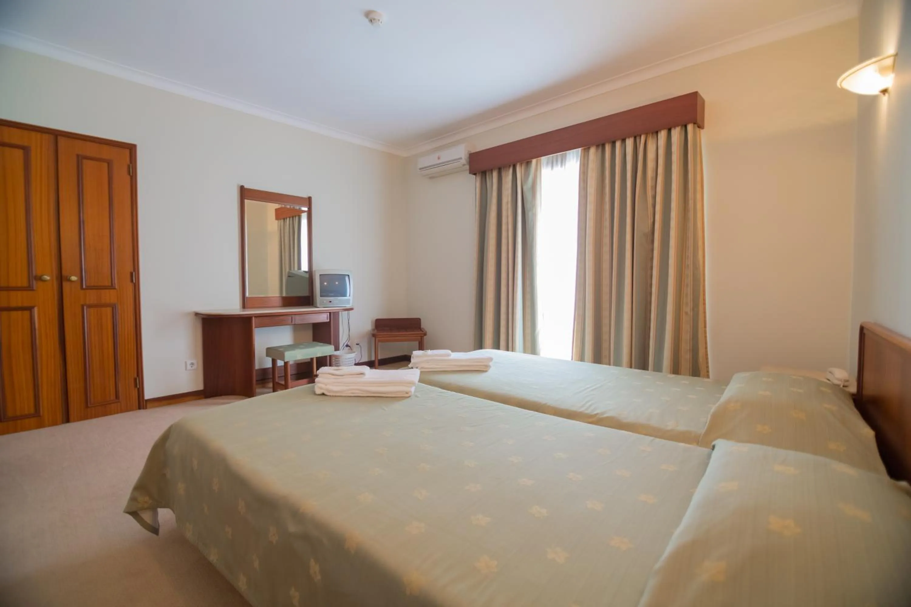 Bed in Hotel Peregrinos de Fatima by Umbral