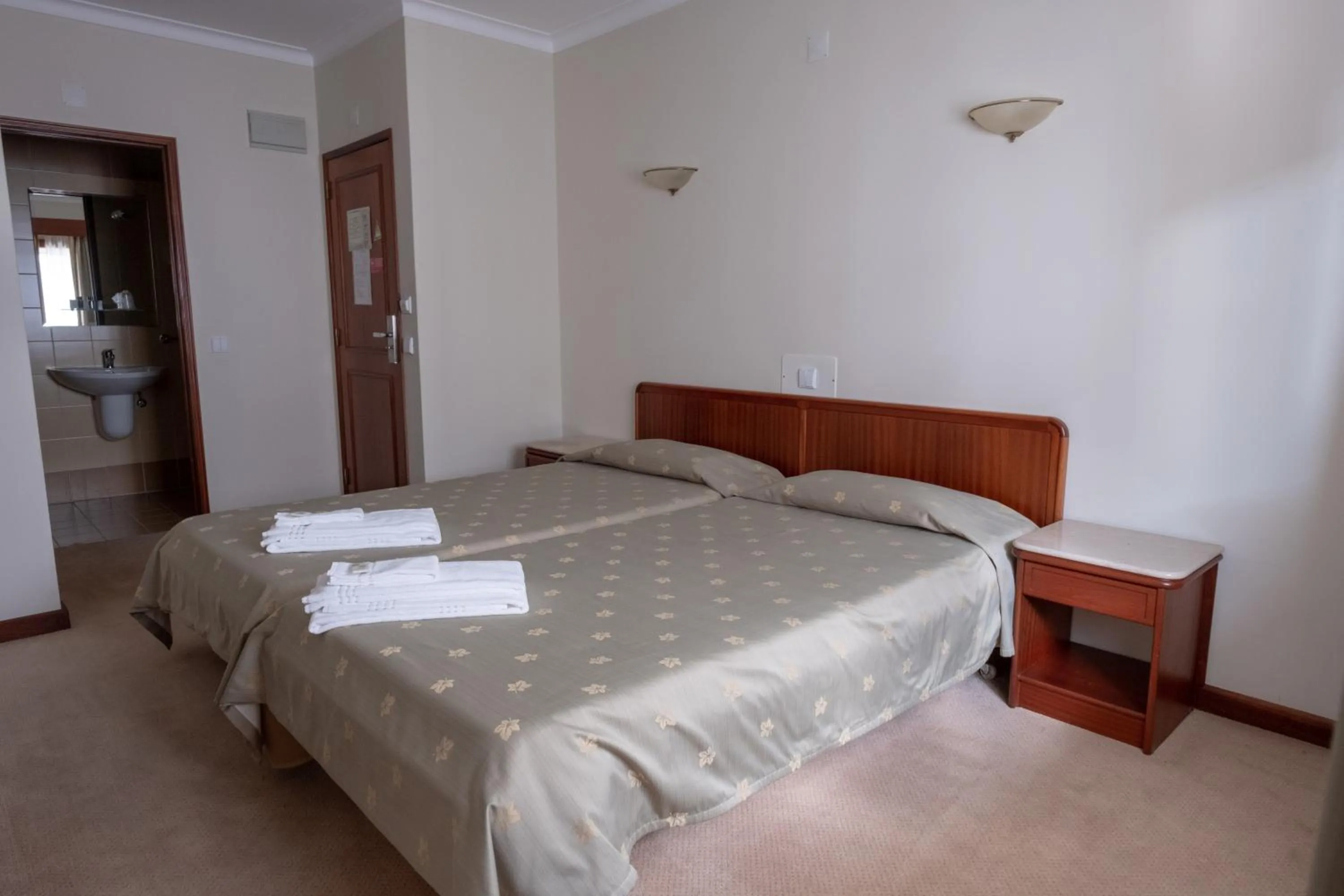 Bed in Hotel Peregrinos de Fatima by Umbral