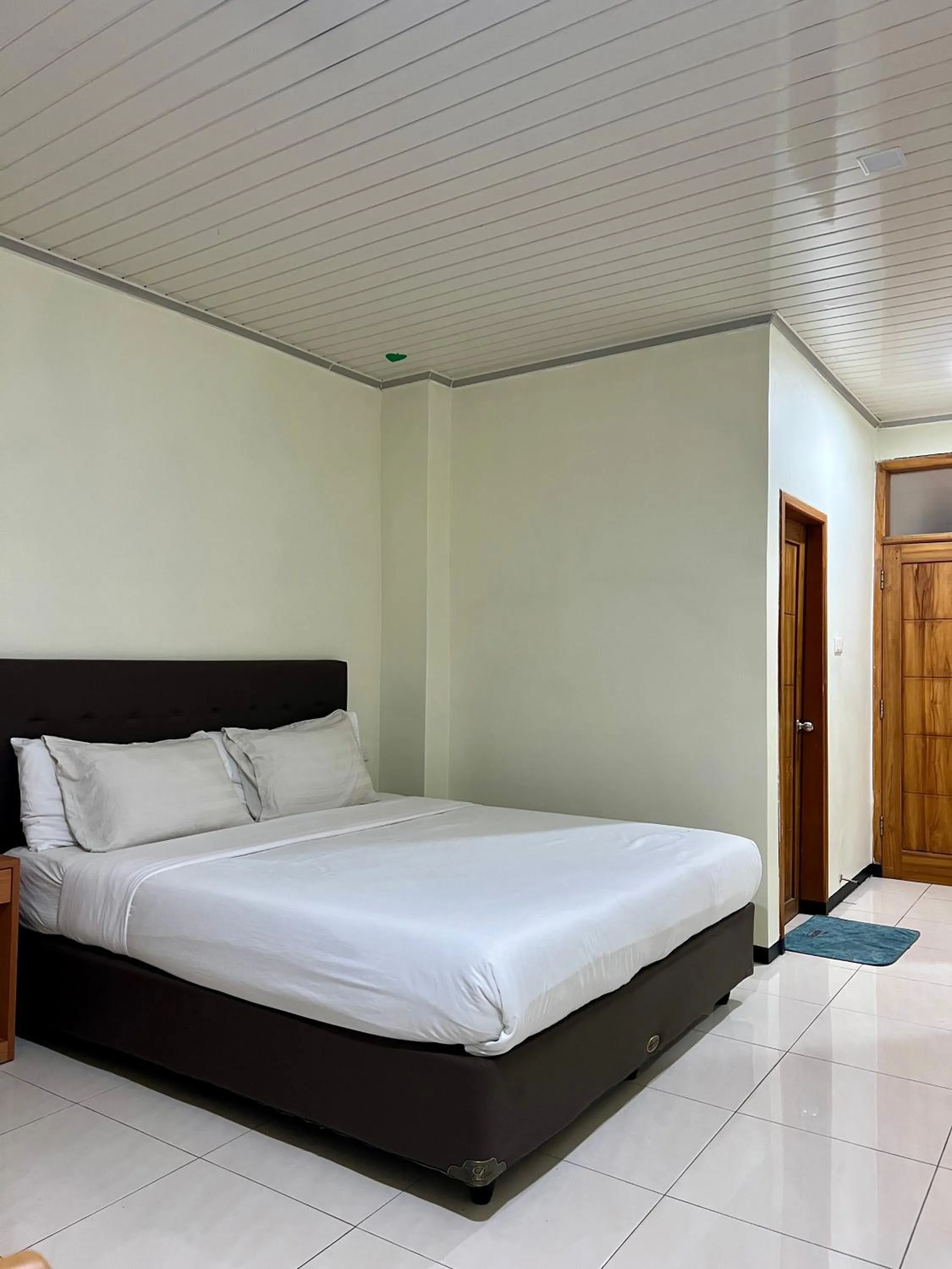 Bed in Aurora Hotel Siliwangi