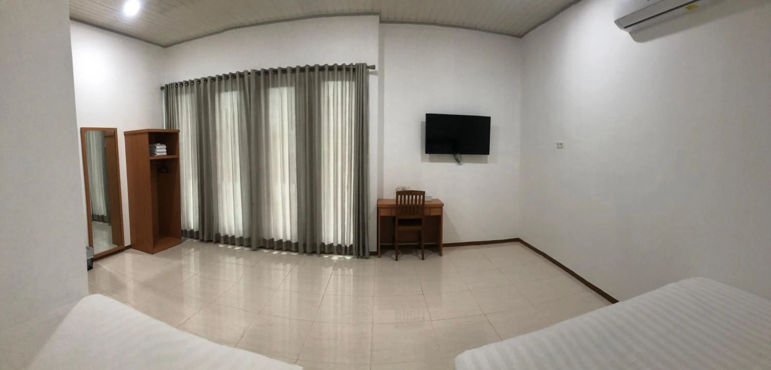 Bed in Aurora Hotel Siliwangi