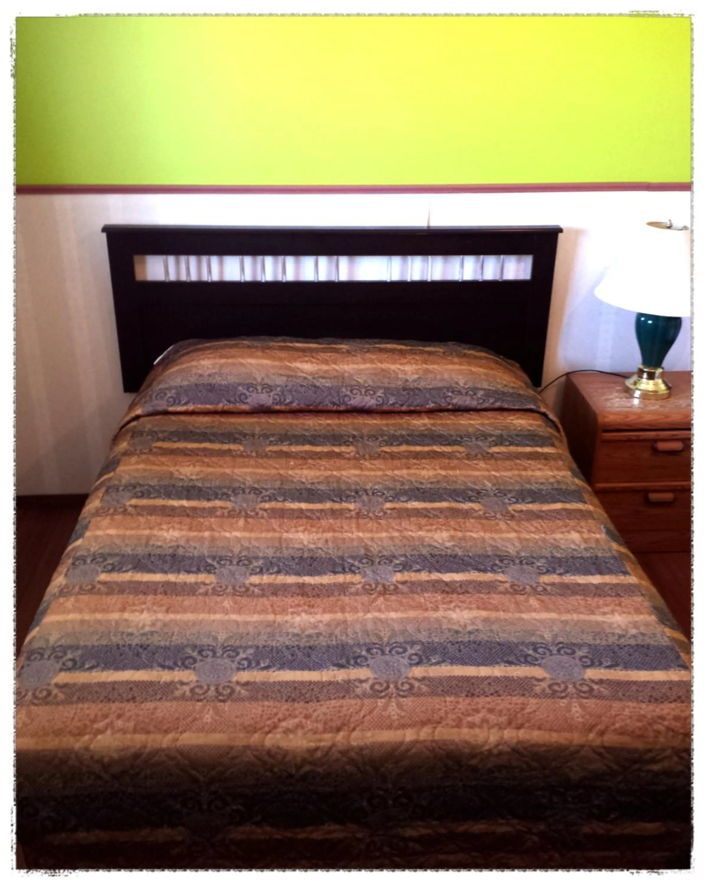 Bed in Moosomin Motel