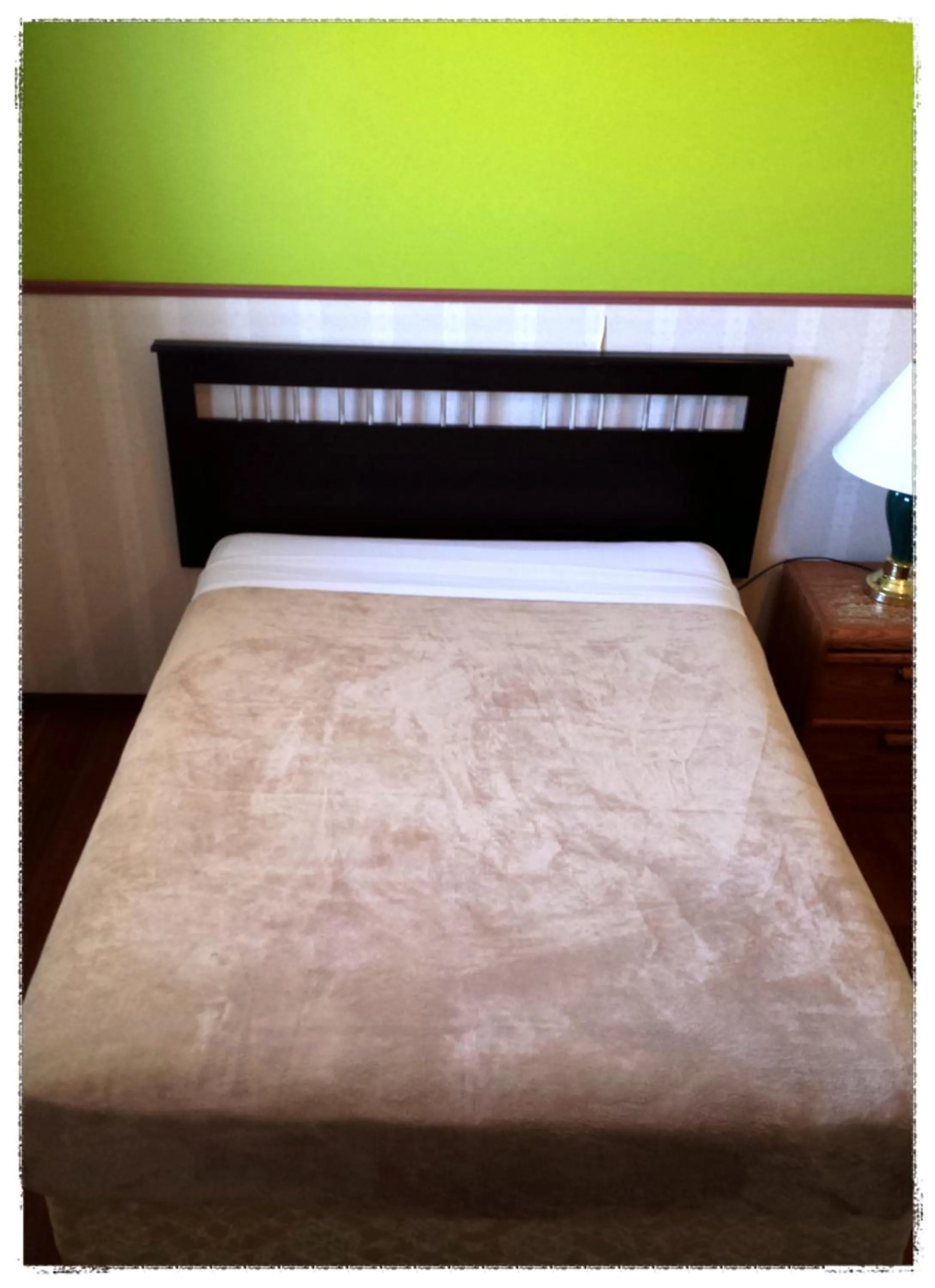 Bed in Moosomin Motel