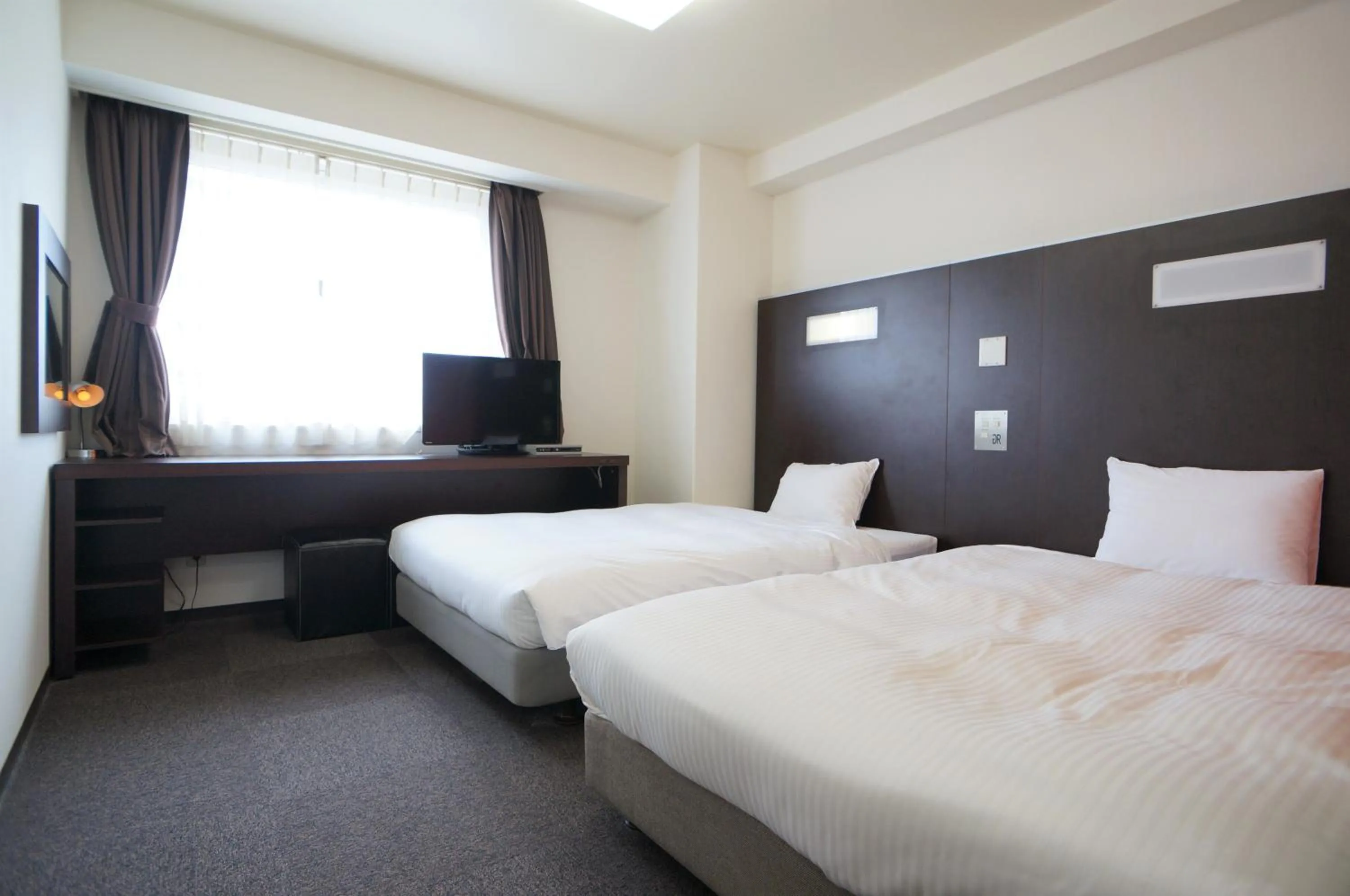 Bedroom, Bed in Green Rich Hotel Suizenji