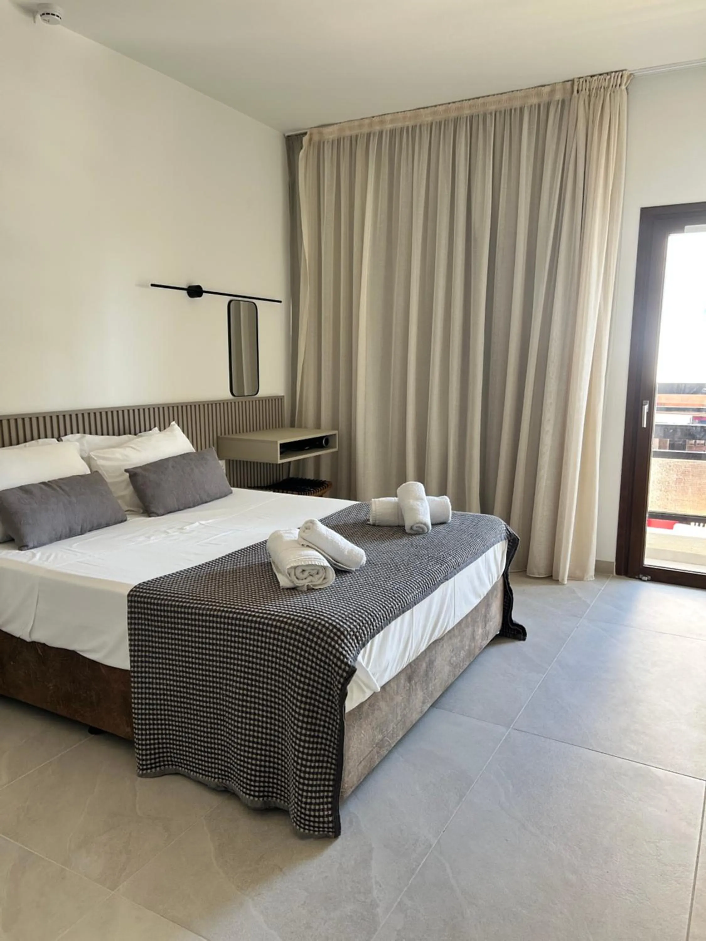 Bed in Pigeon Beach Hotel Apartments