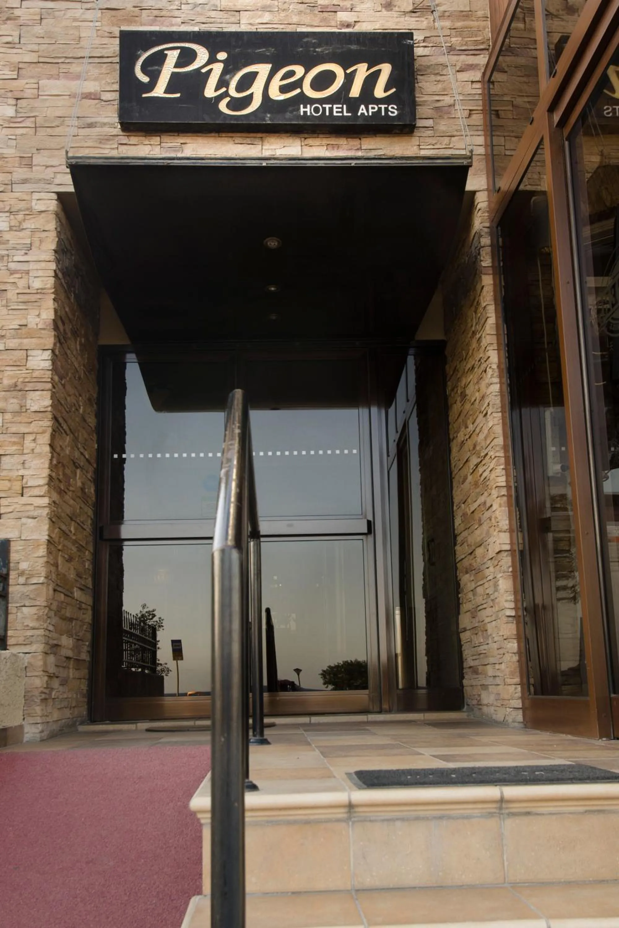 Facade/entrance in Pigeon Beach Hotel Apartments