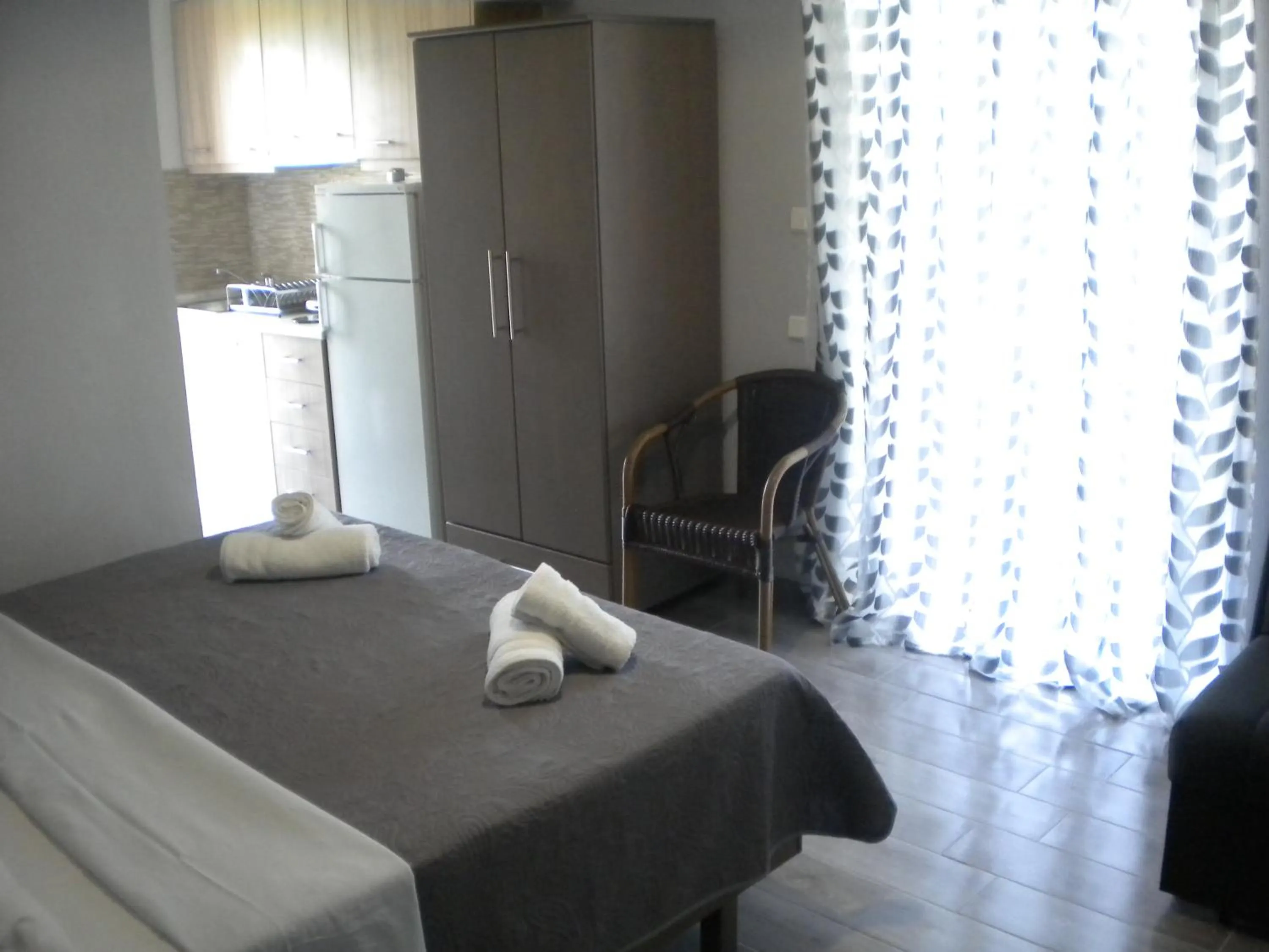 Kitchen or kitchenette, Bed in Nostos Apartments
