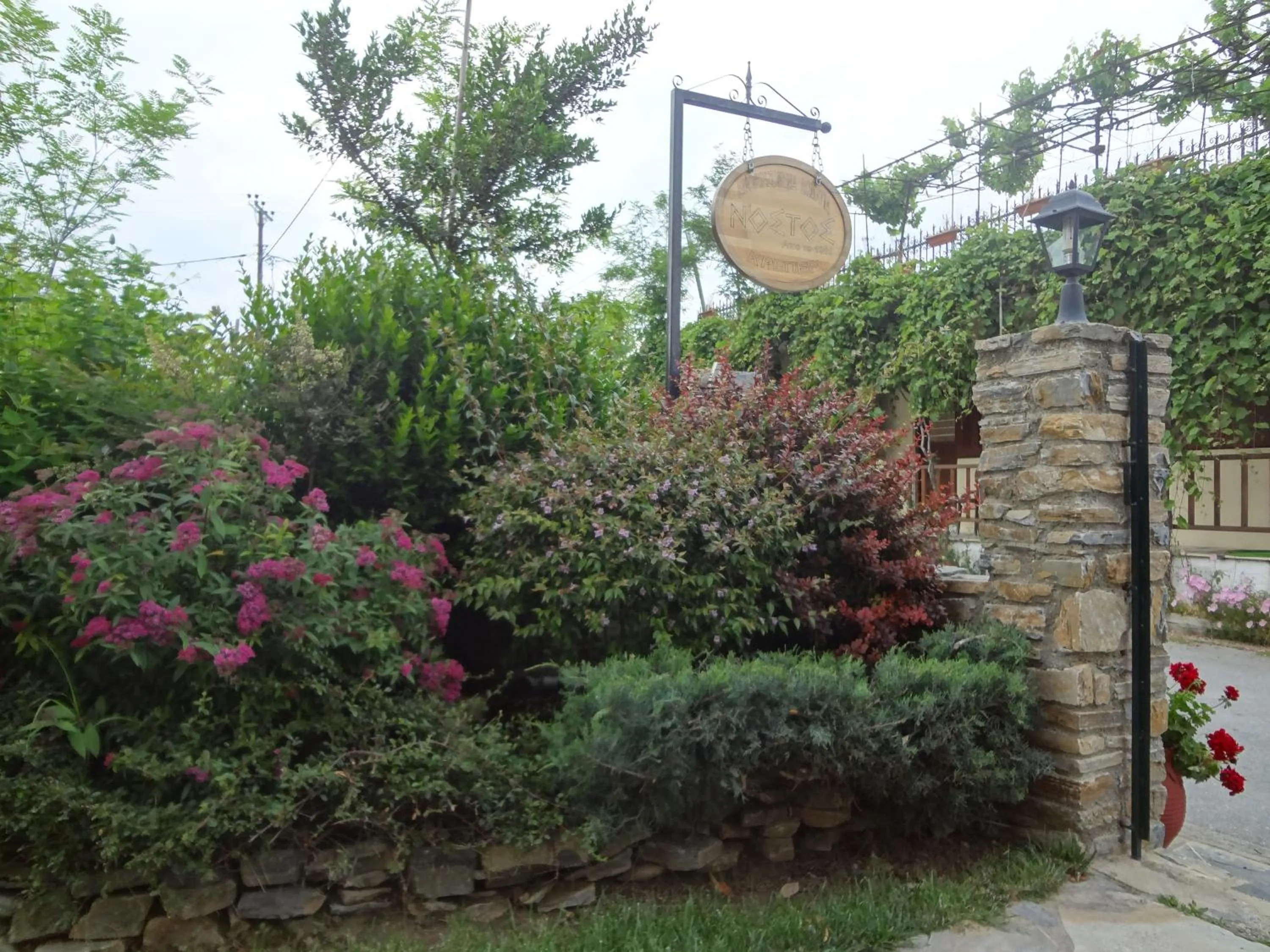 Property logo or sign in Nostos Apartments