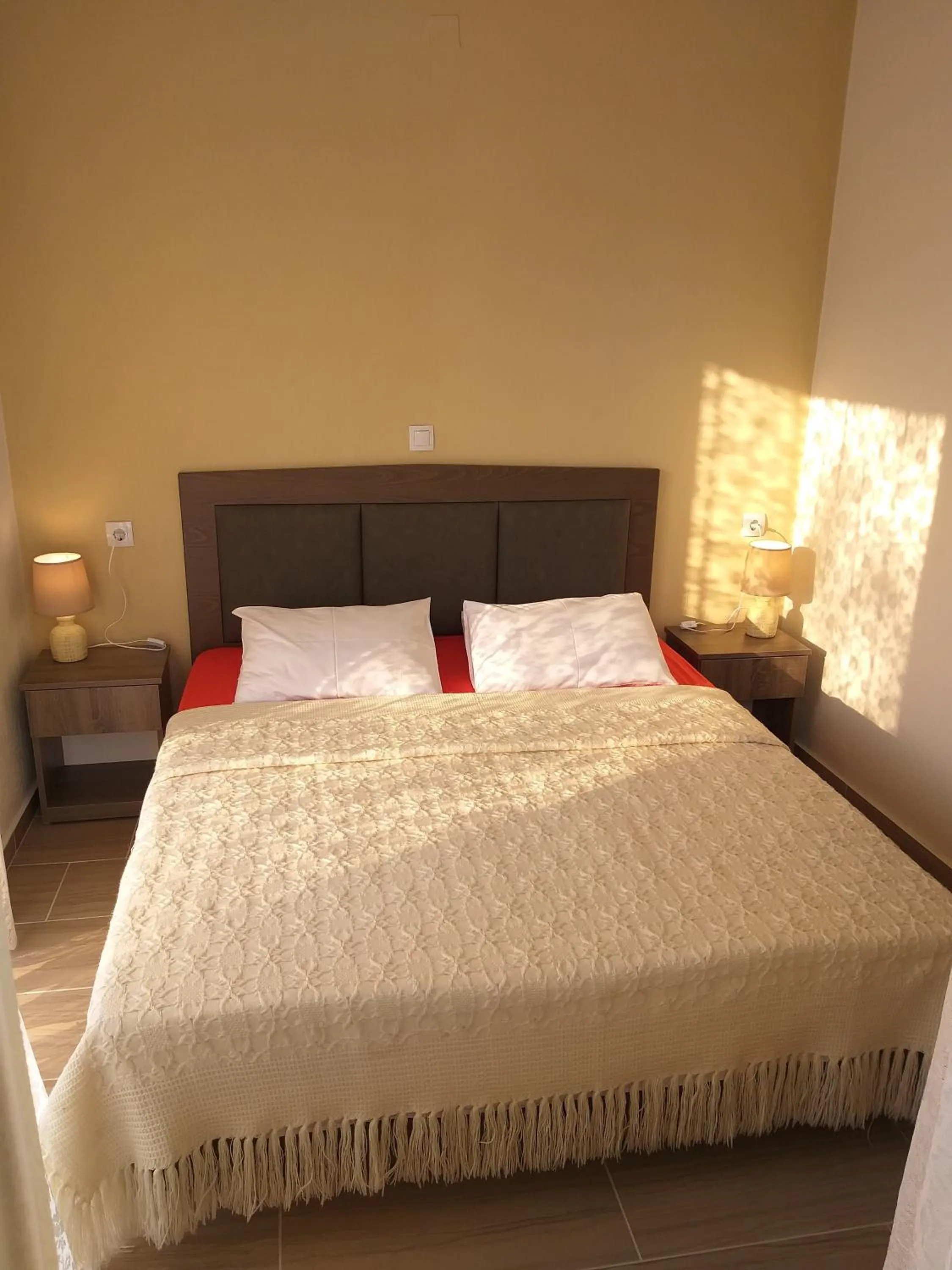 Bed in Nostos Apartments