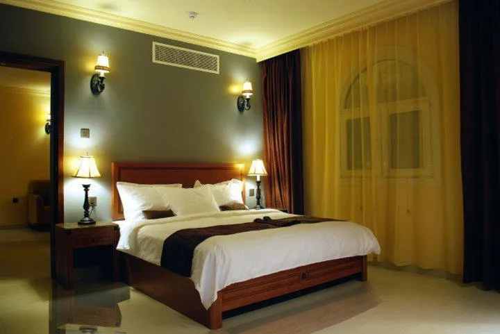 Bed in La Rosa Hotel Oman